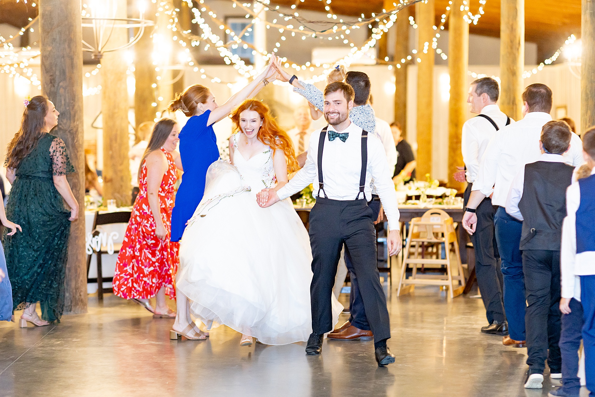 newlyweds enter wedding reception