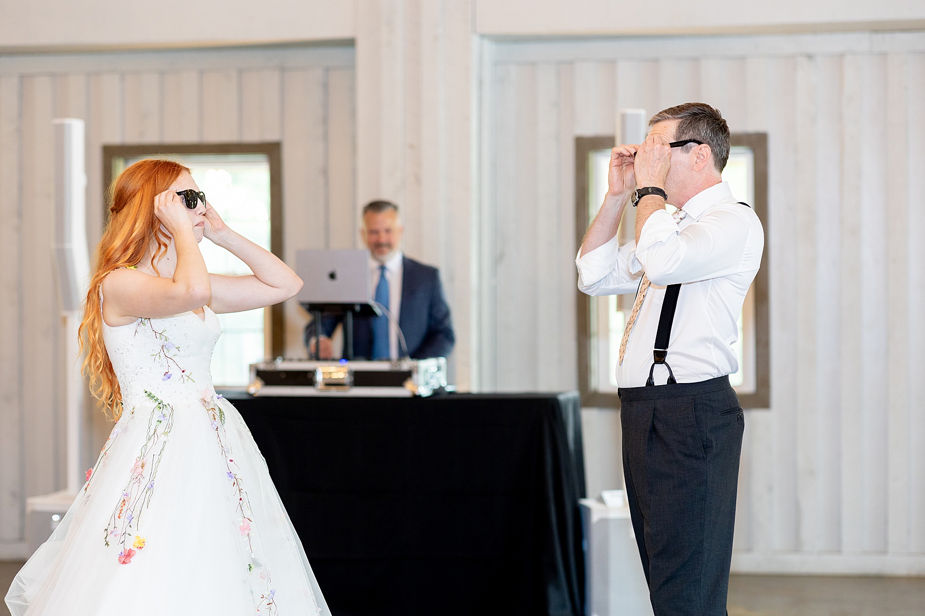 bride and father put on sunglasses for fun choreographed dance