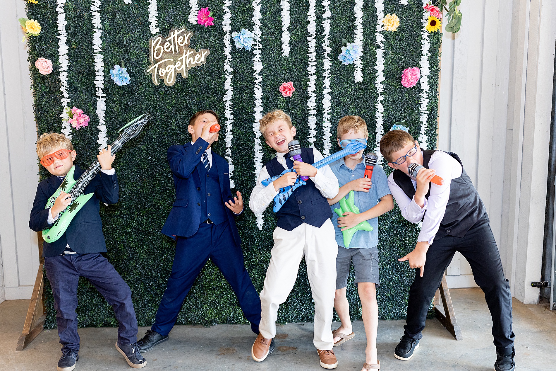 children have fun at wedding reception with inflatable instruments