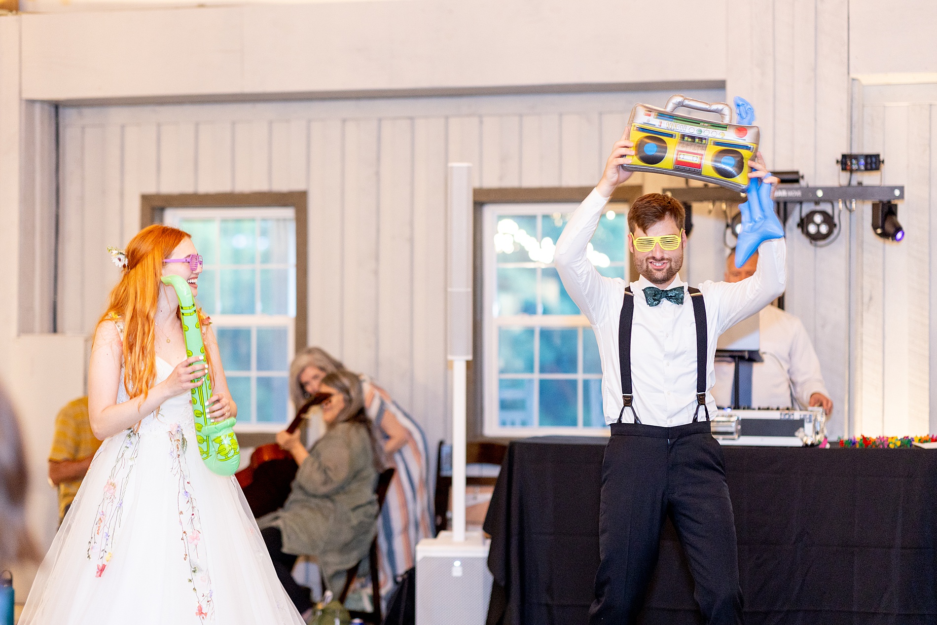 bride and groom with inflatable instruments