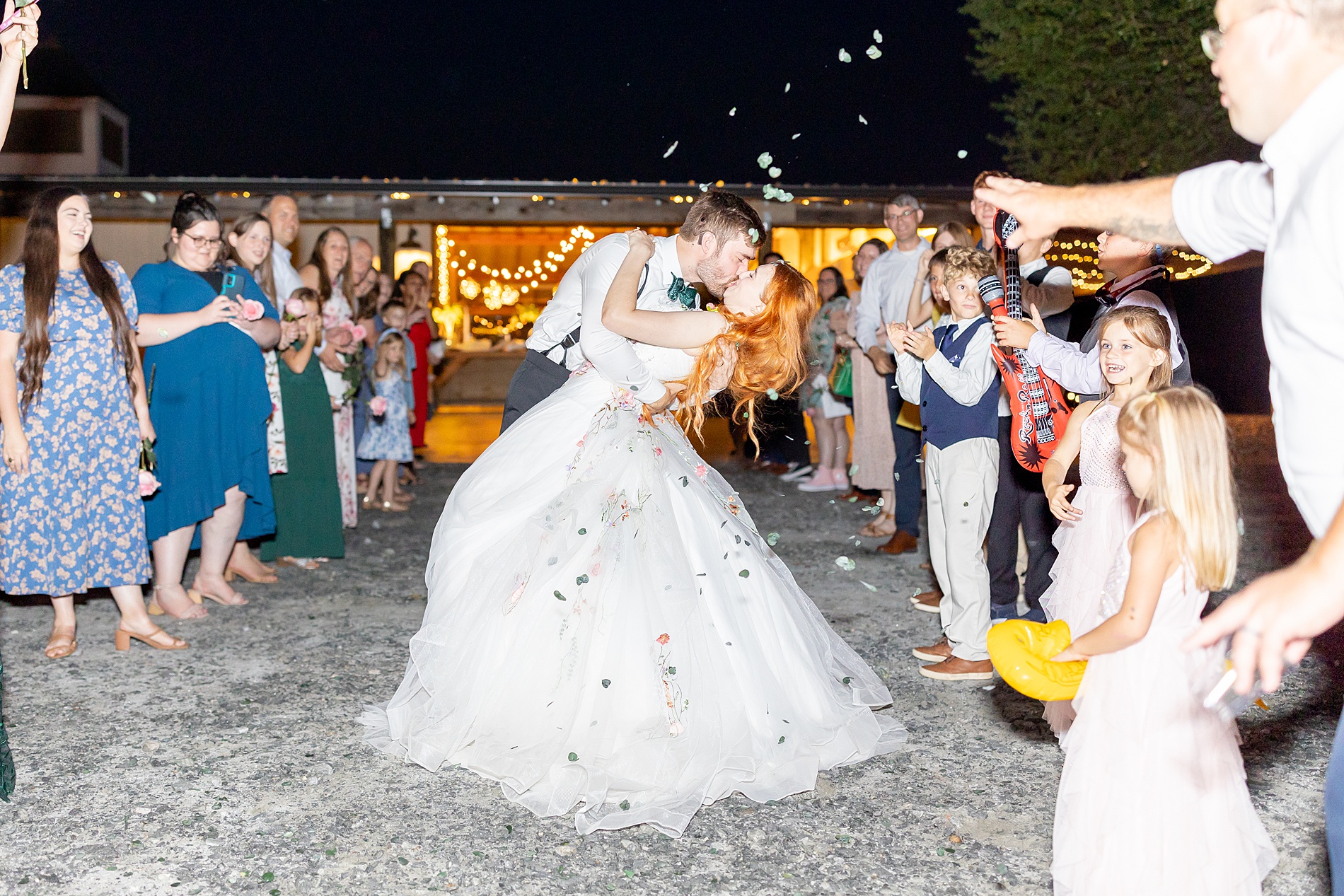 newlyweds kiss during wedding exit