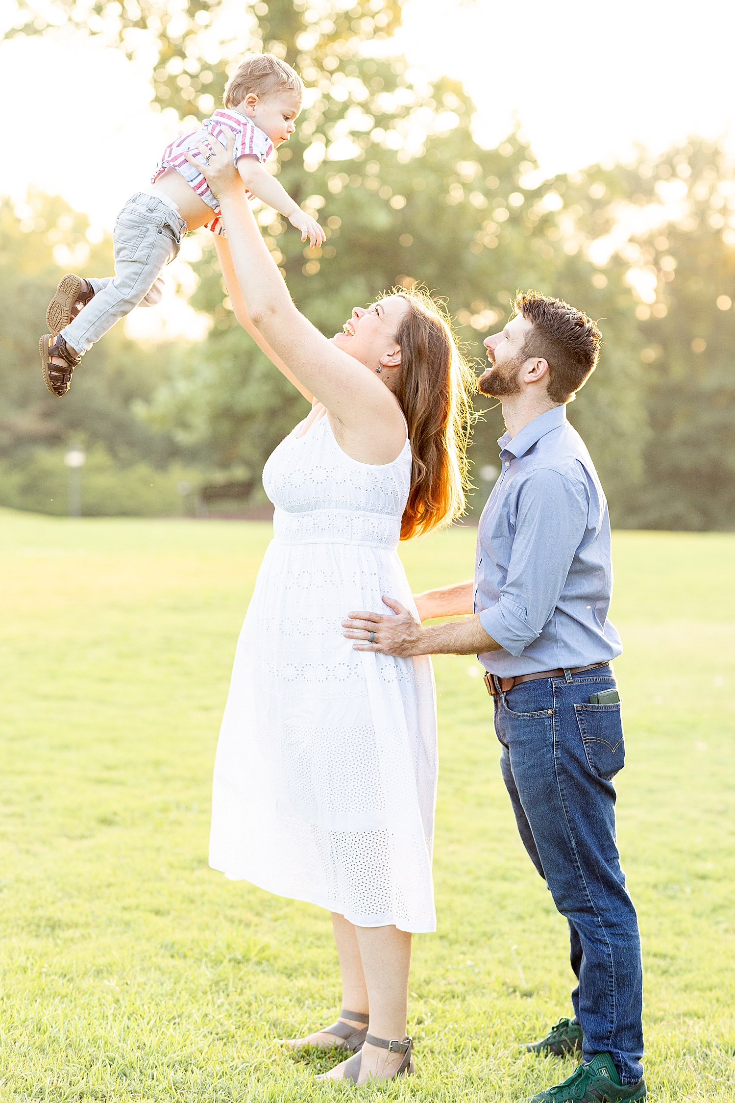 parents lift their son up 