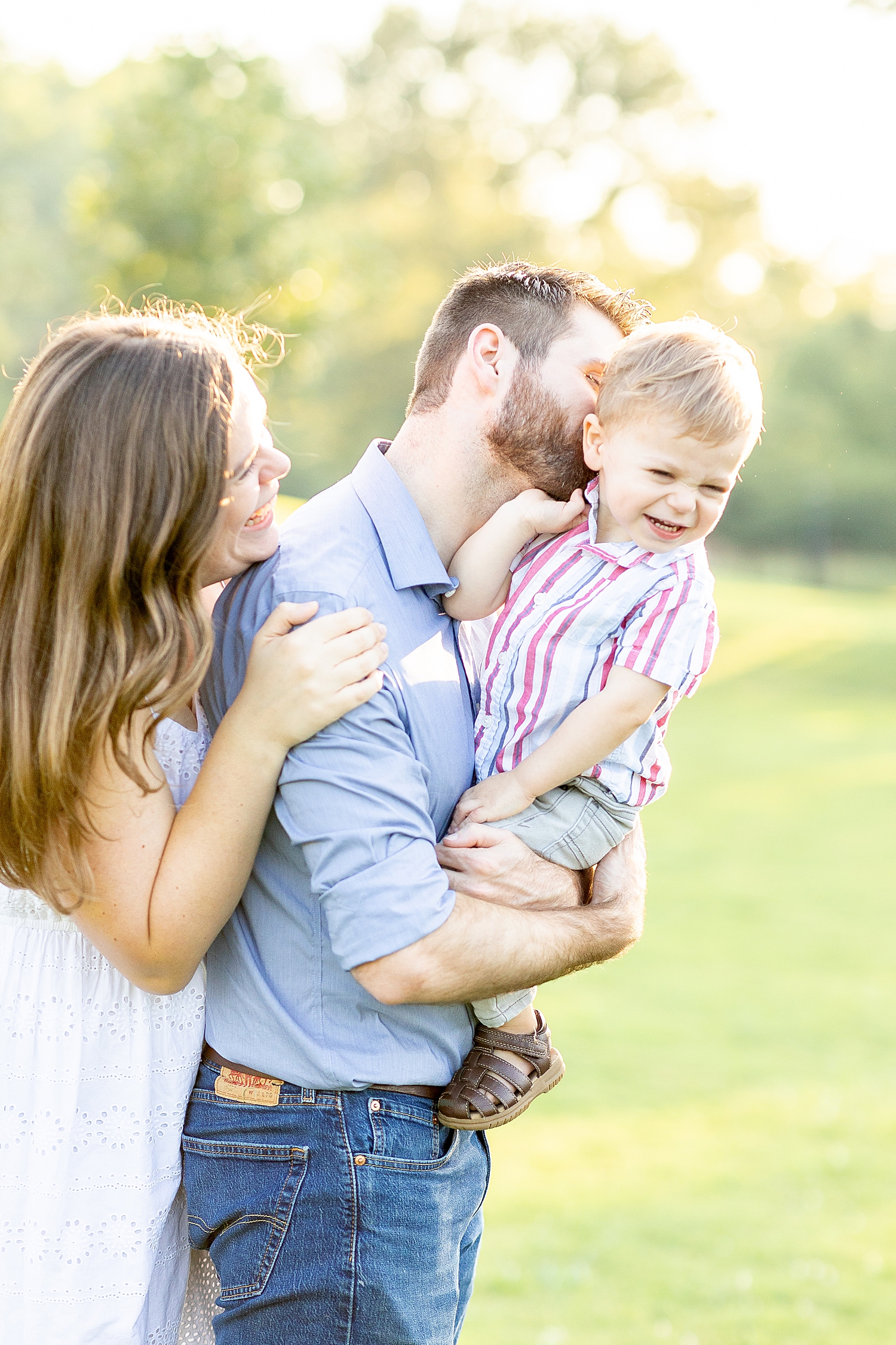 mom and dad with their son during Legacy Park Family Session