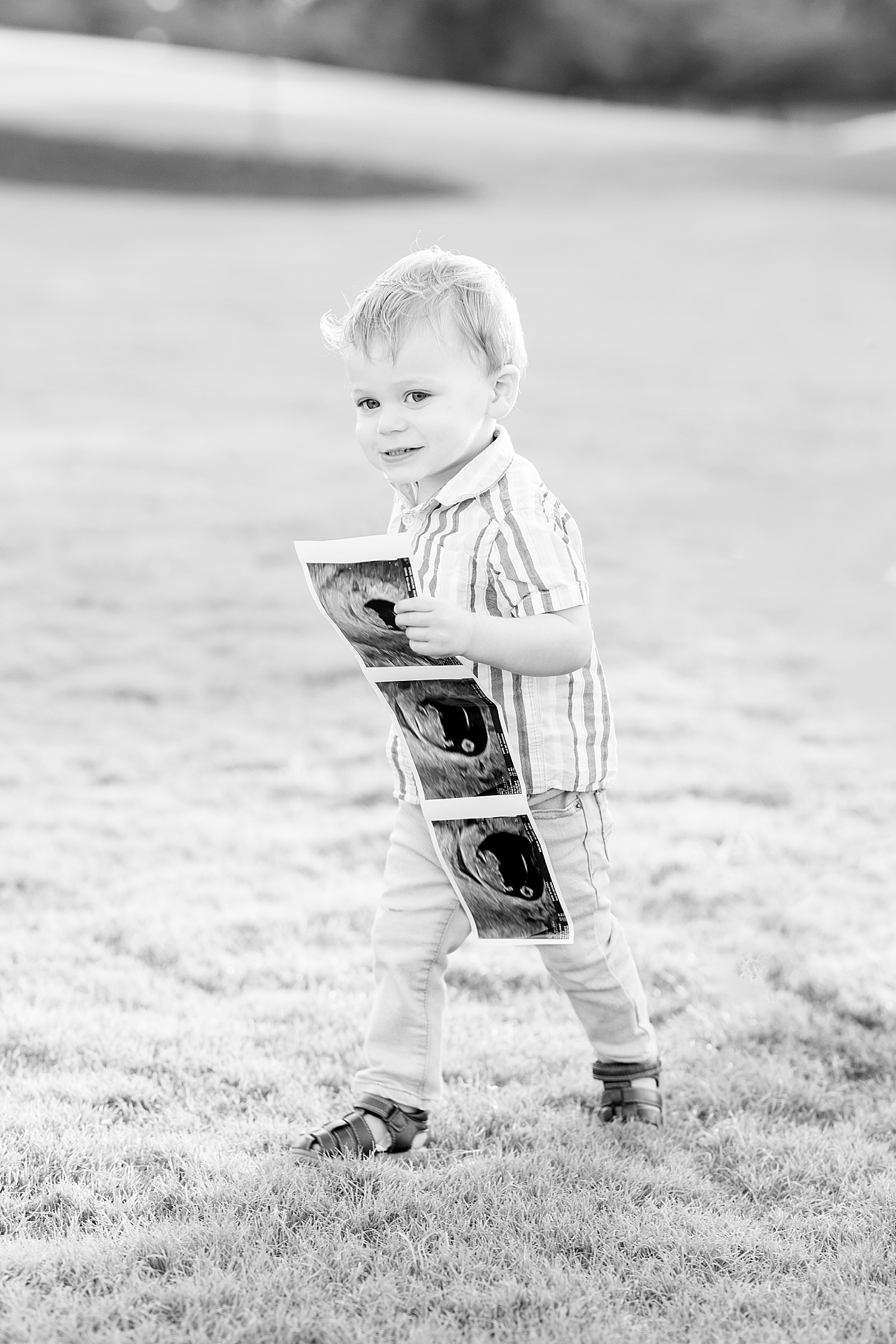 timeless photo of little boy with sonogram 