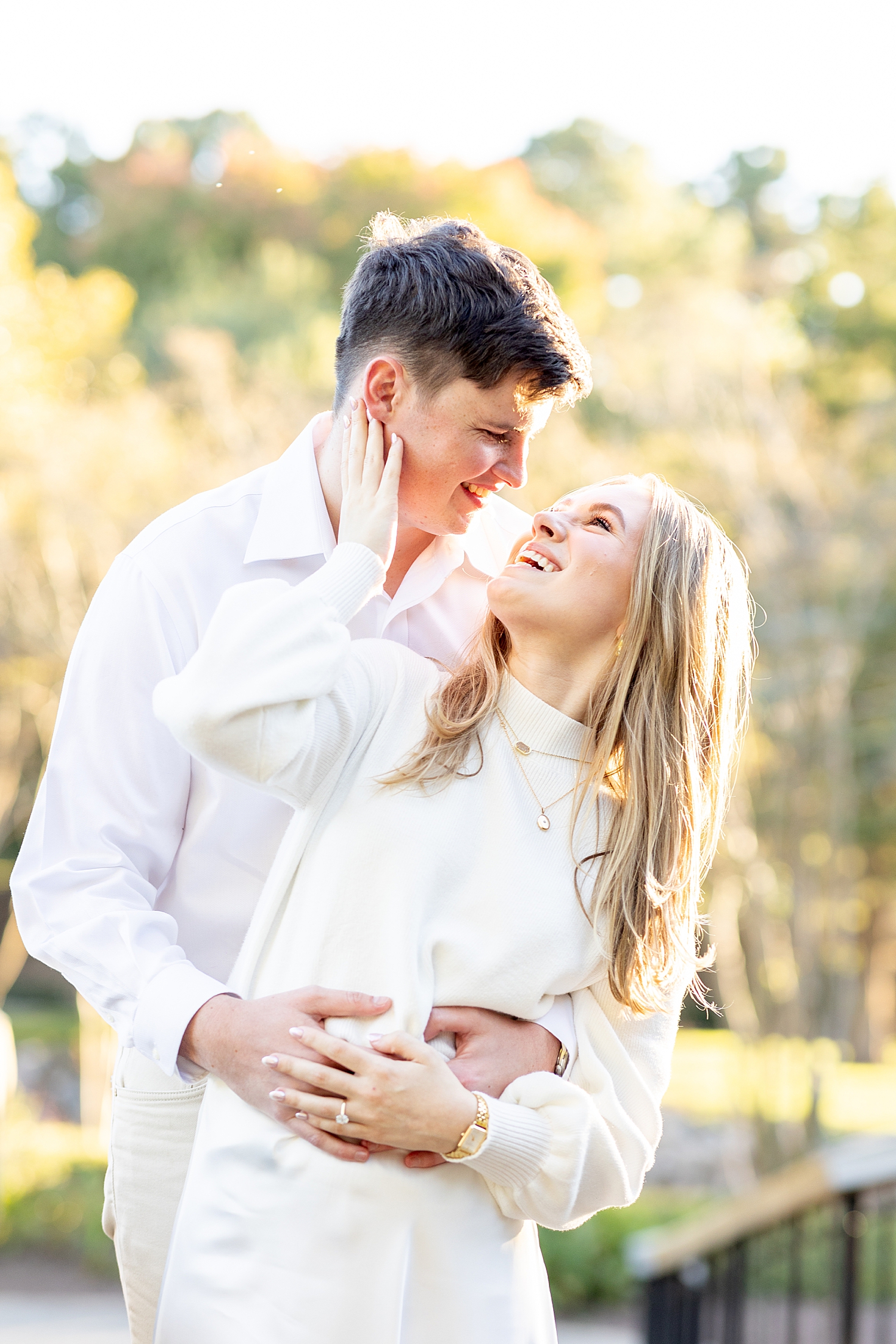 couple hug on bridge