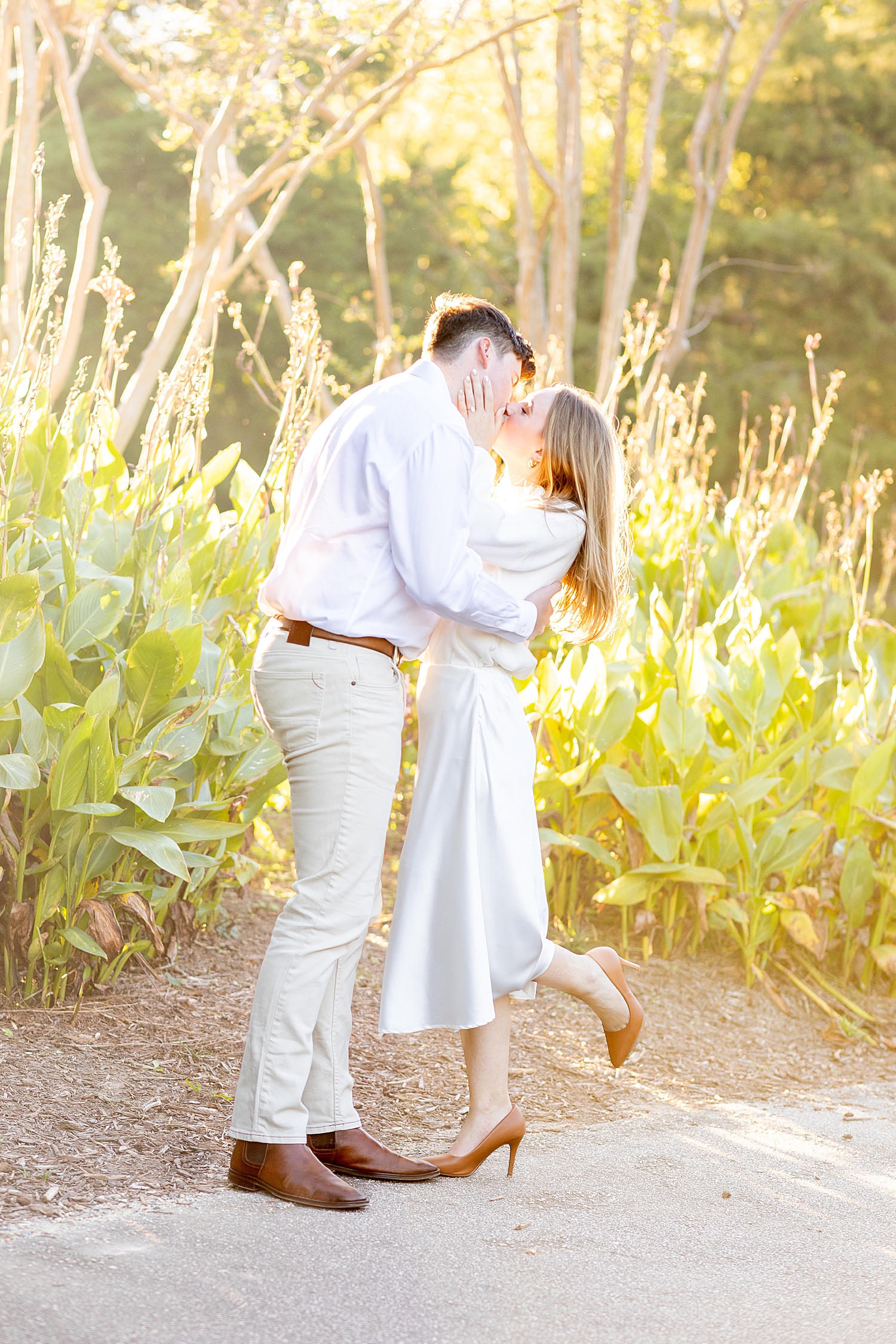 newly engaged couple kiss