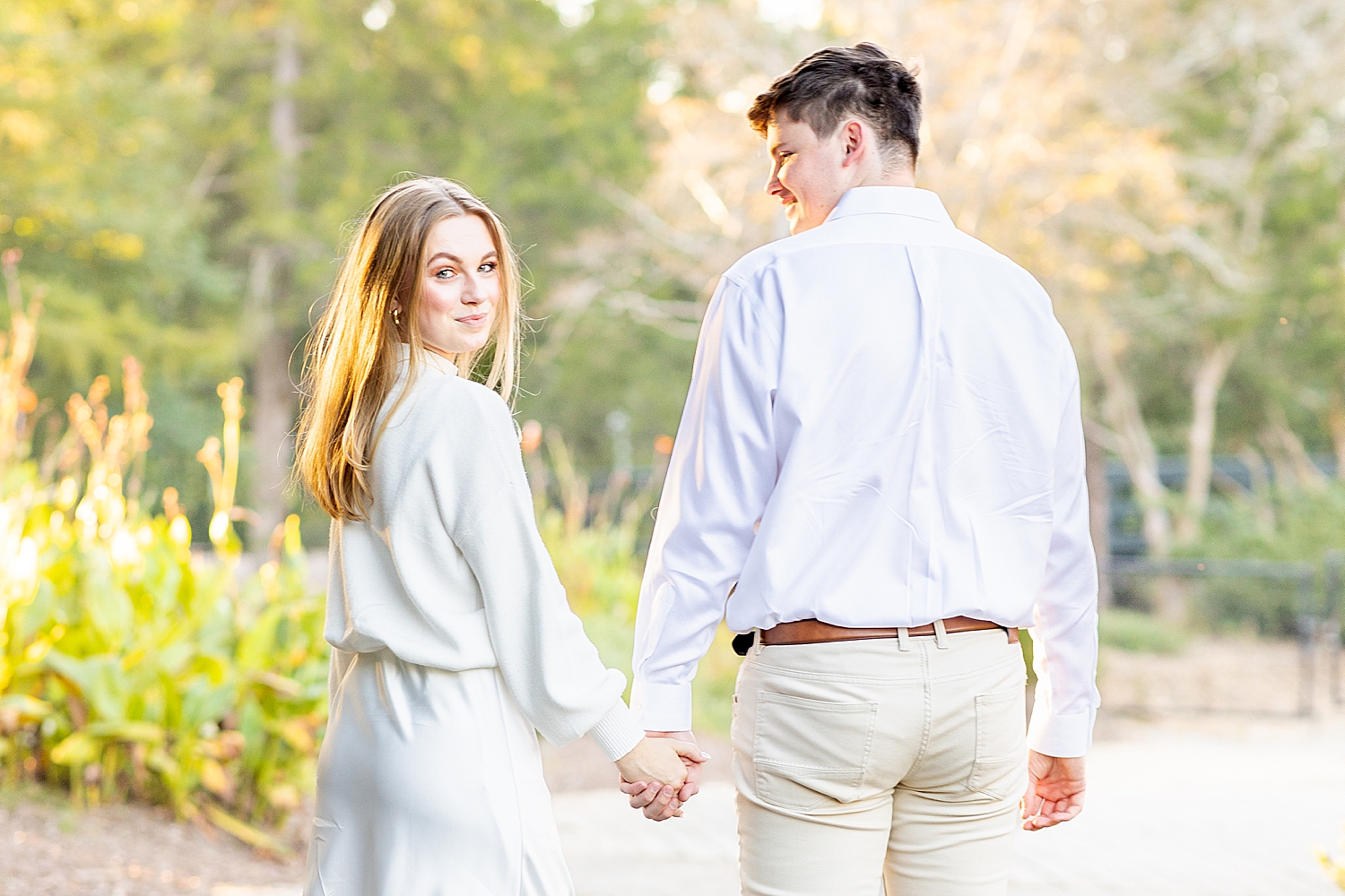 couple walk together holding hands