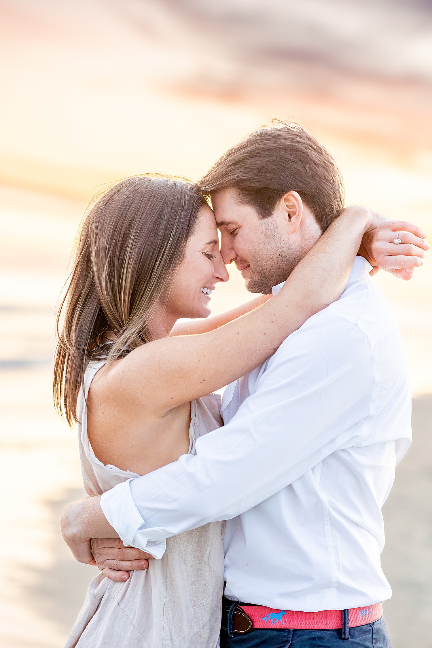 couple lean in together during Romantic Engagement Session  