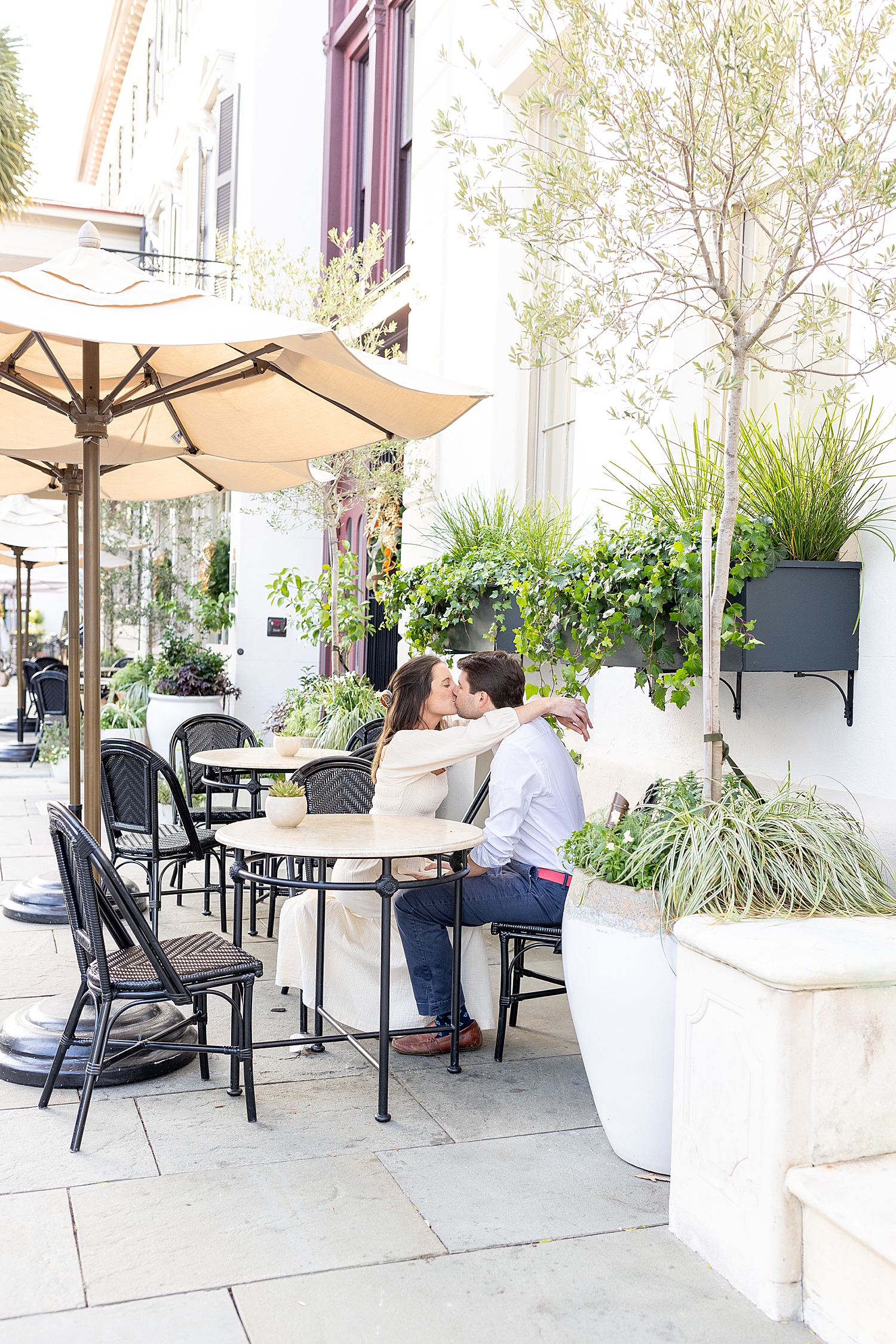 couple kiss during downtown Charleston engagement session