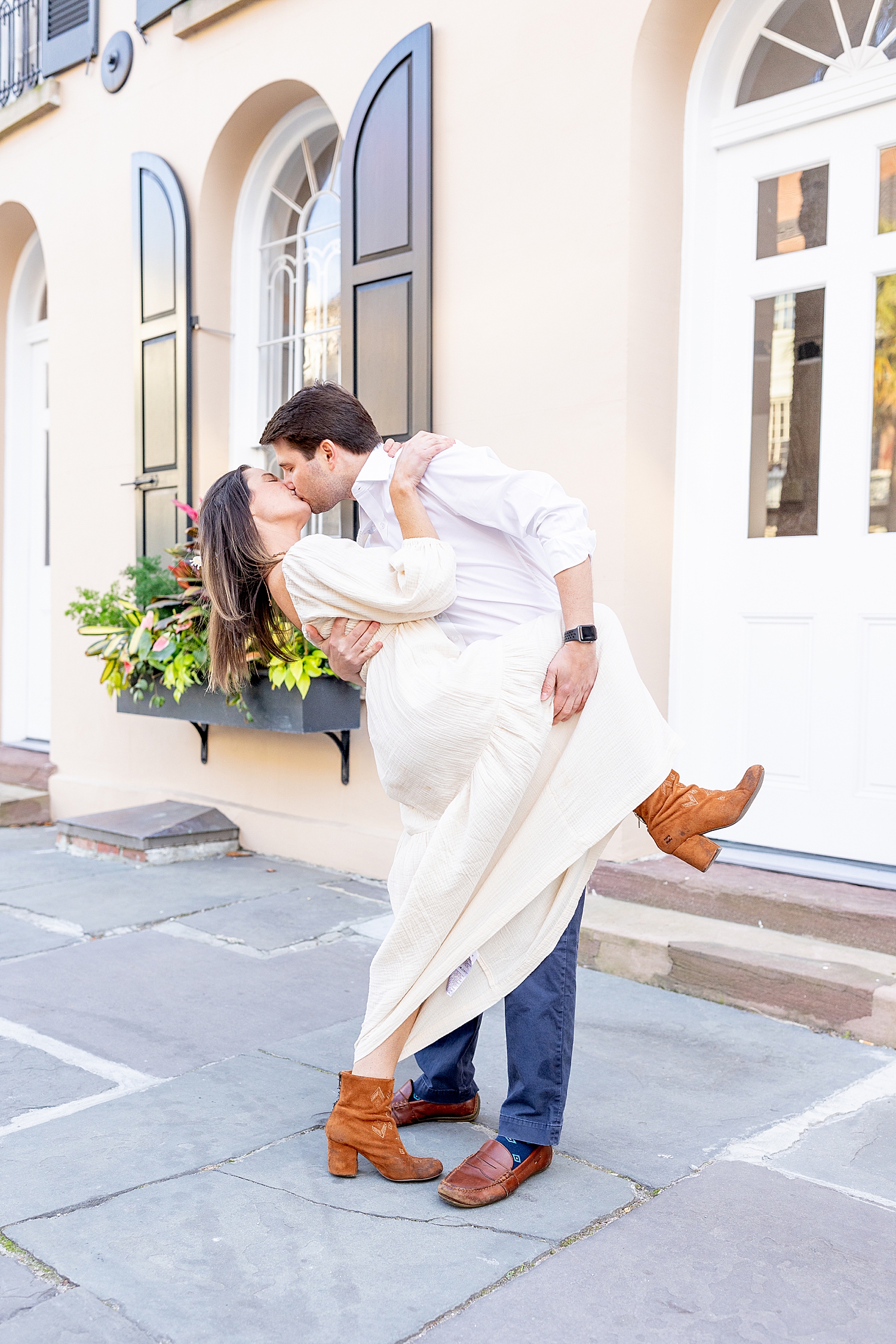 guy dips his fiance as they kiss