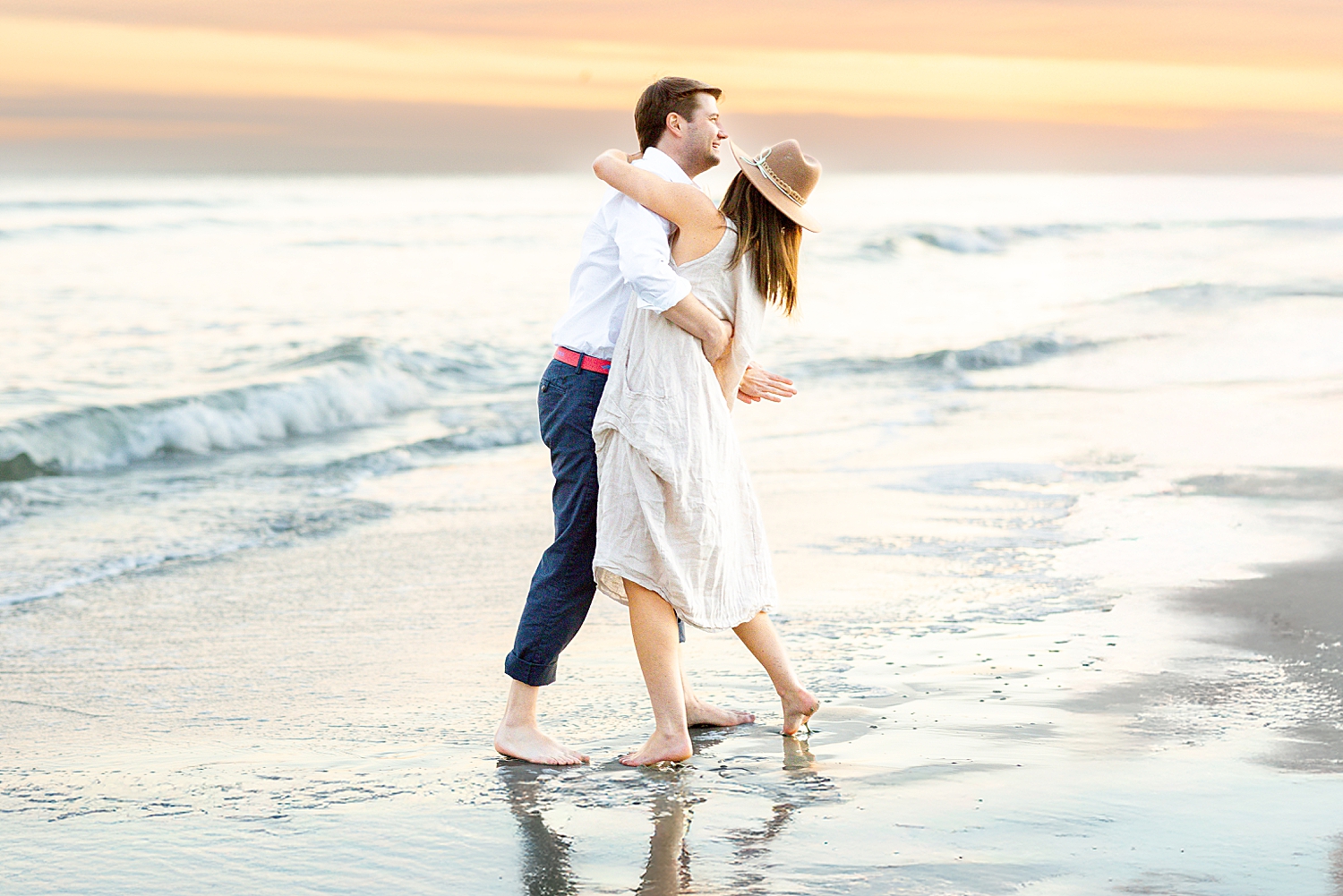 couple dance and hug on the beach