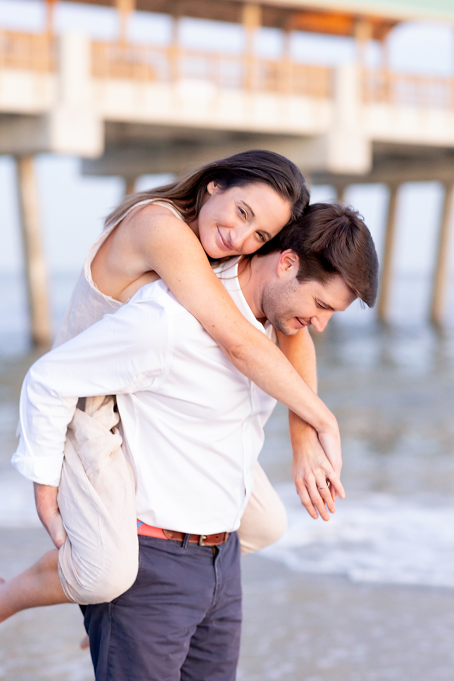 guy carries his fiance on his back