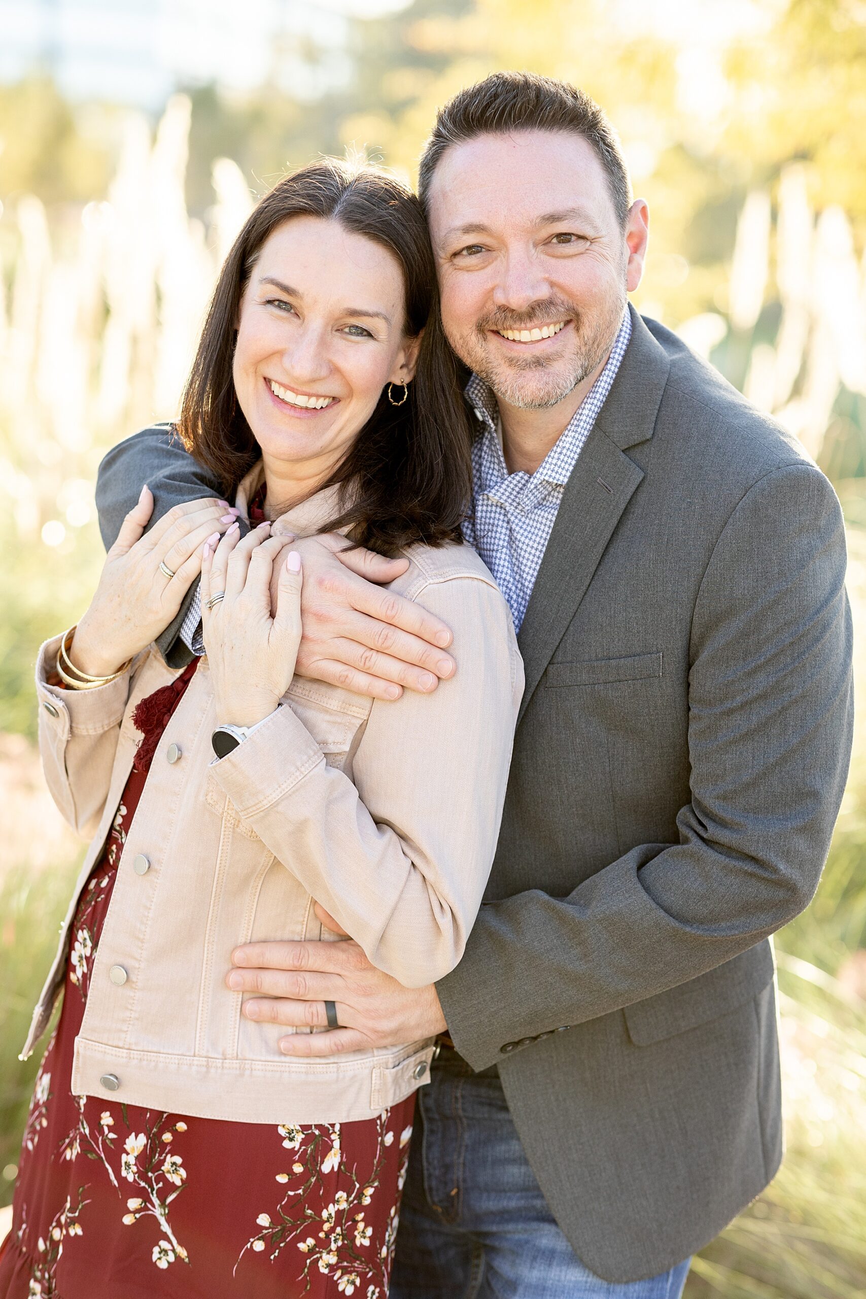 mom and dad hug during family portrait session in Texas