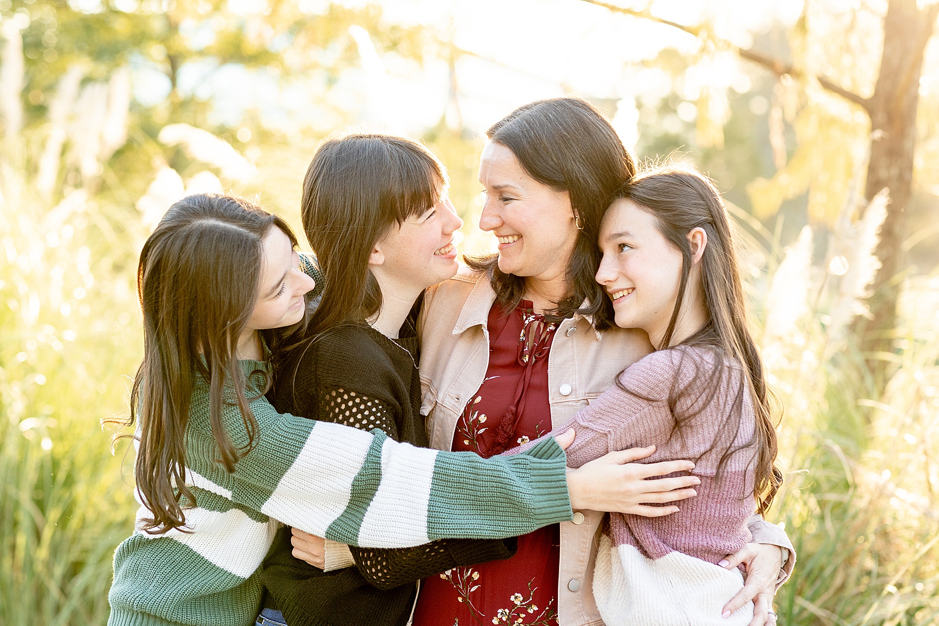 candid portrait of mom and daughters 