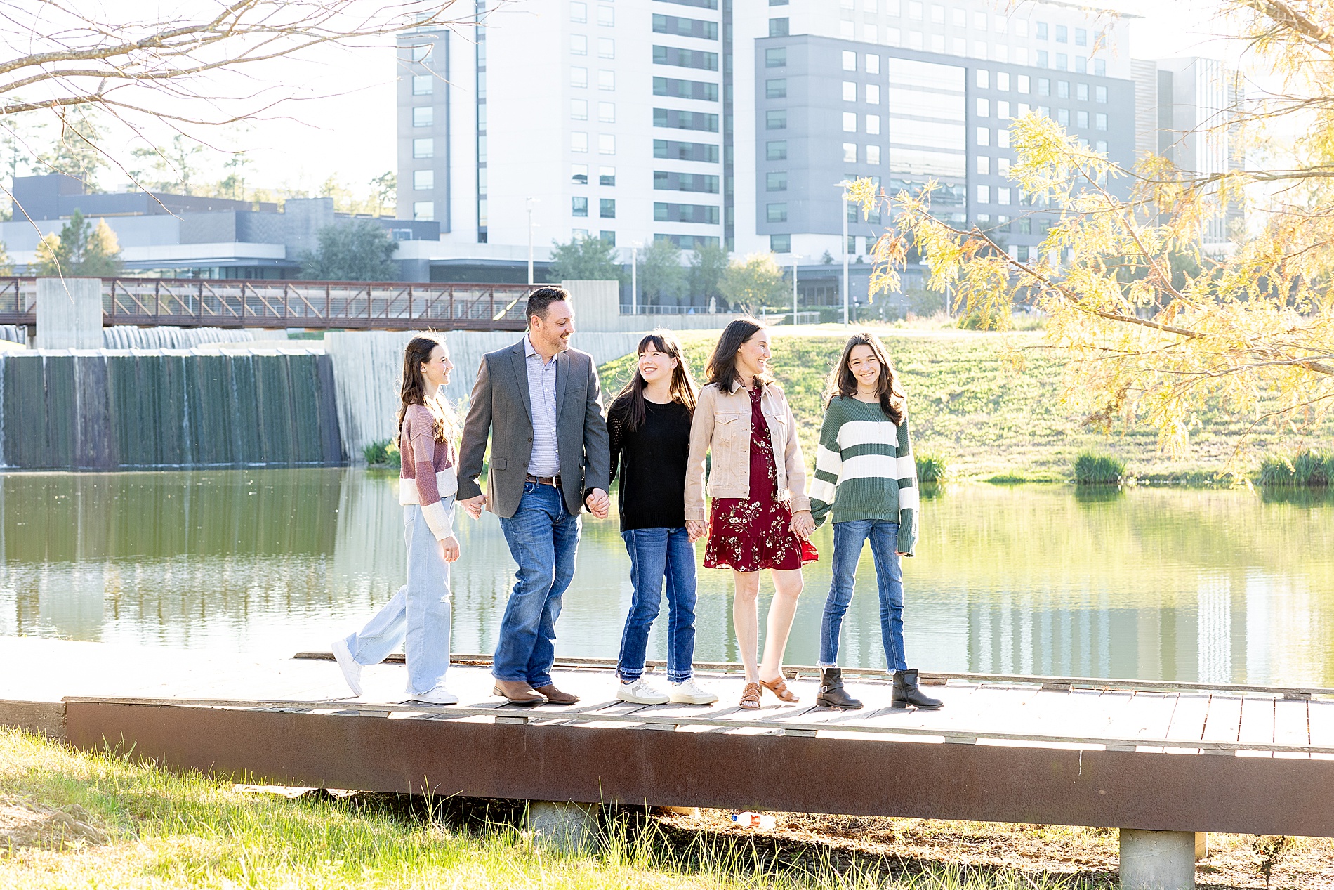 texas family hold hands and walk together