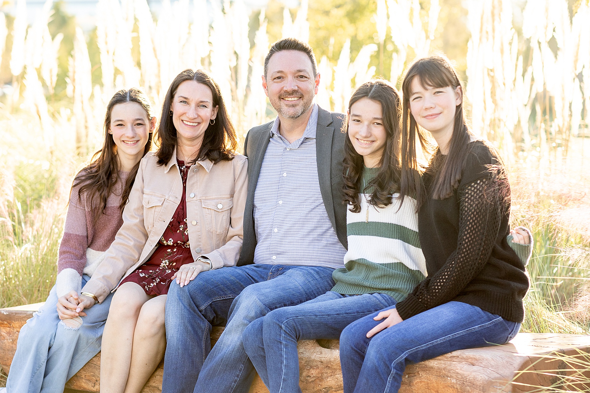 family on bench in Texas at City Place in The Woodlands