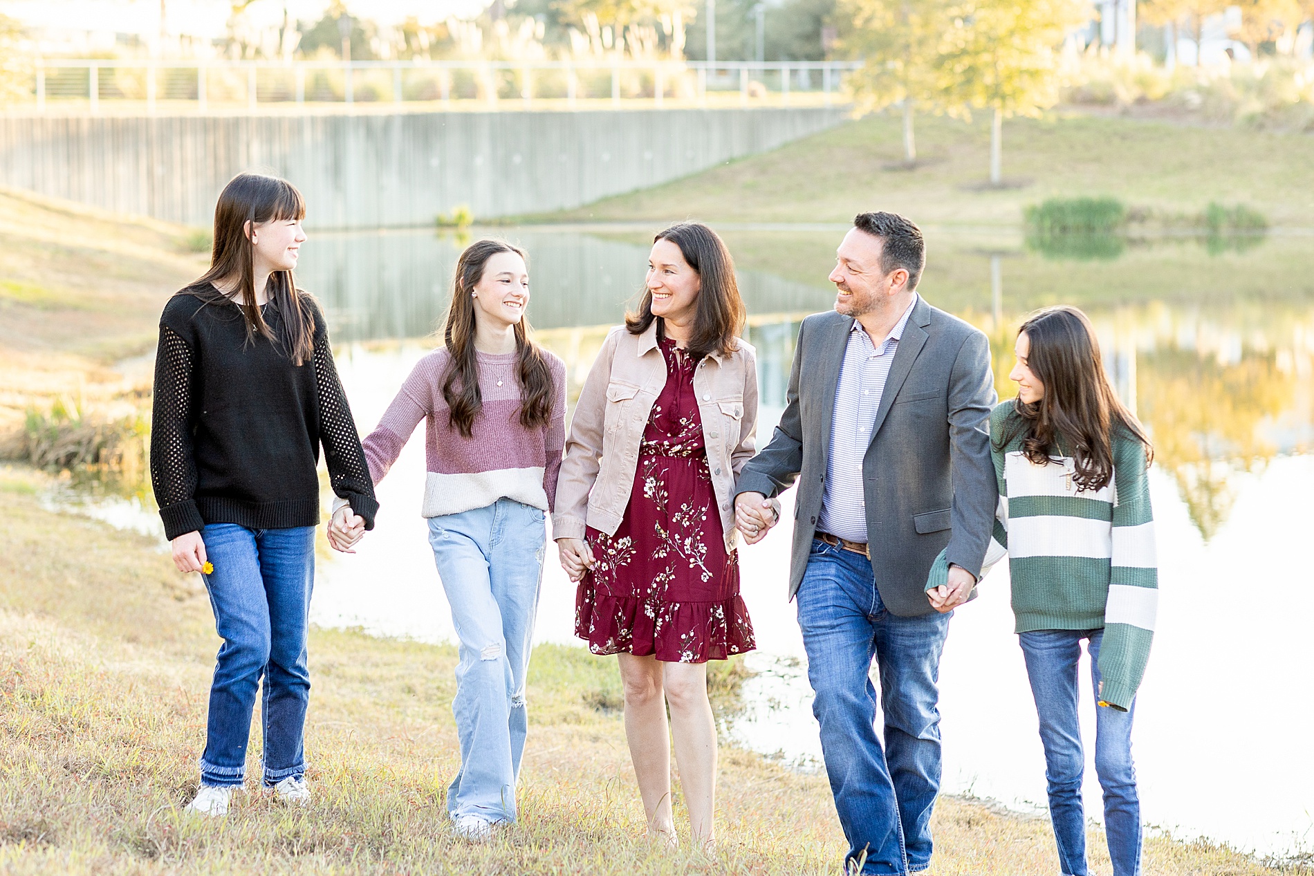 family walk together holding hands 