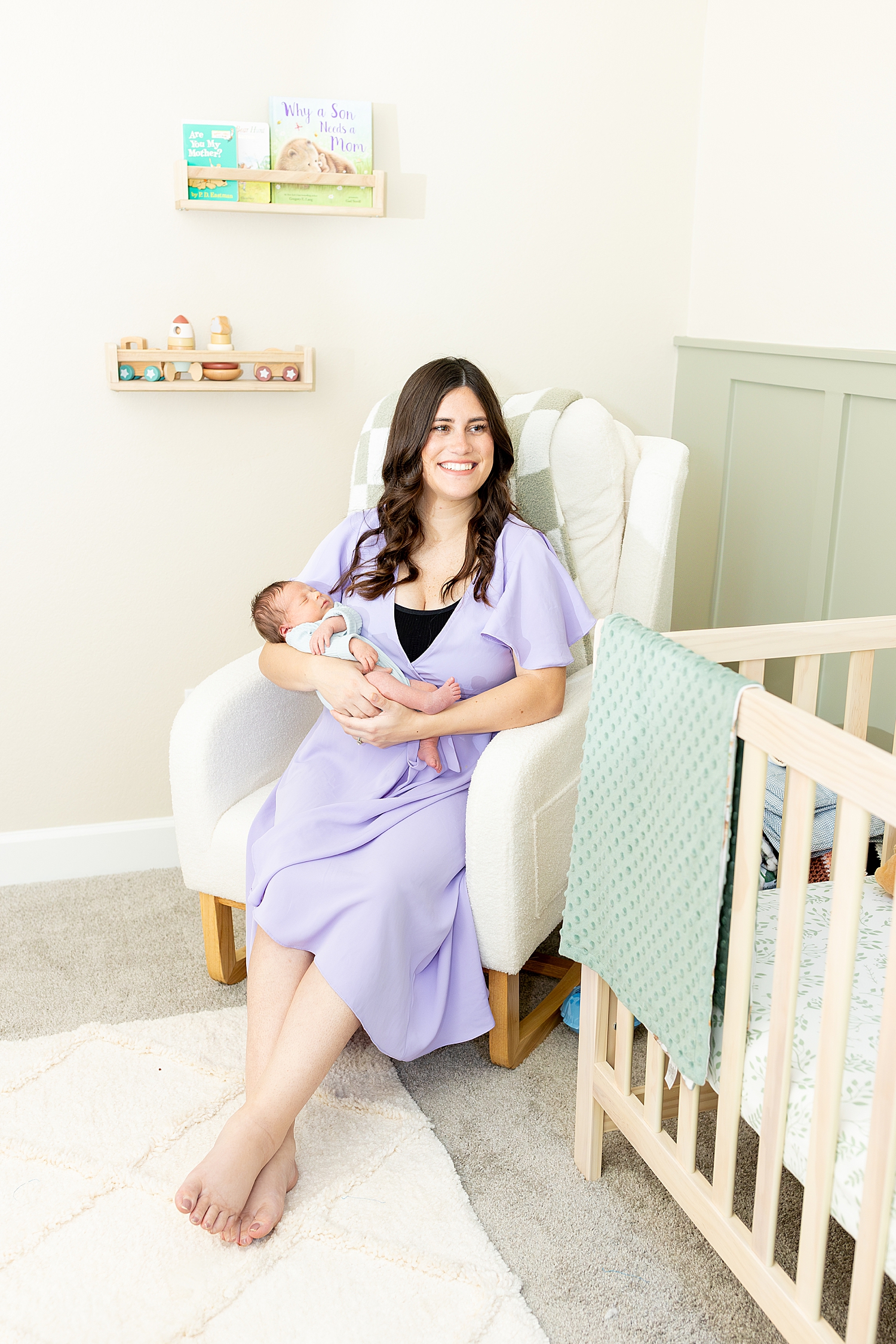 mom with newborn in nursery during Tender In-Home Newborn Session