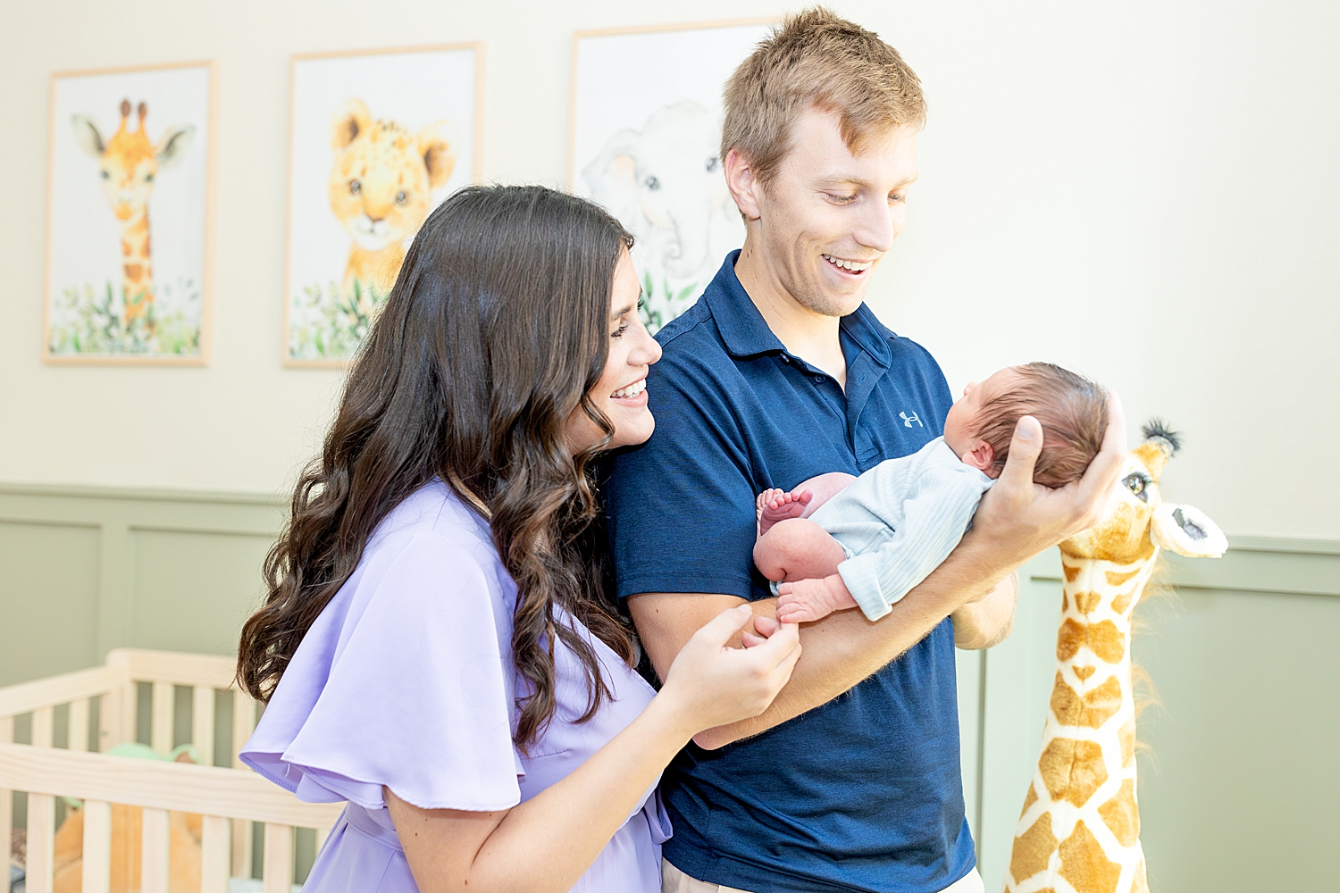 candid family photos in newborn nursery