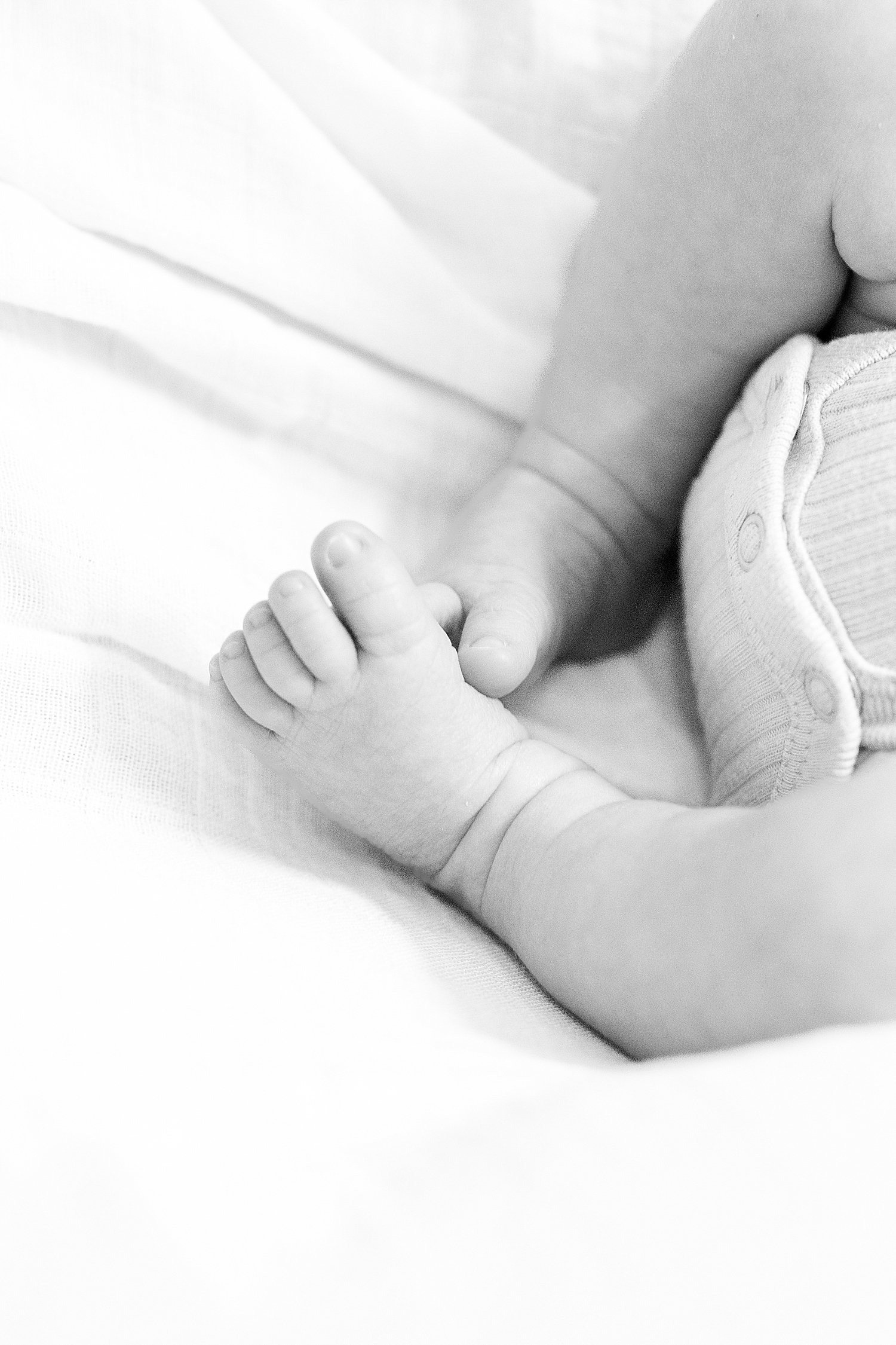 tiny feet of newborn boy