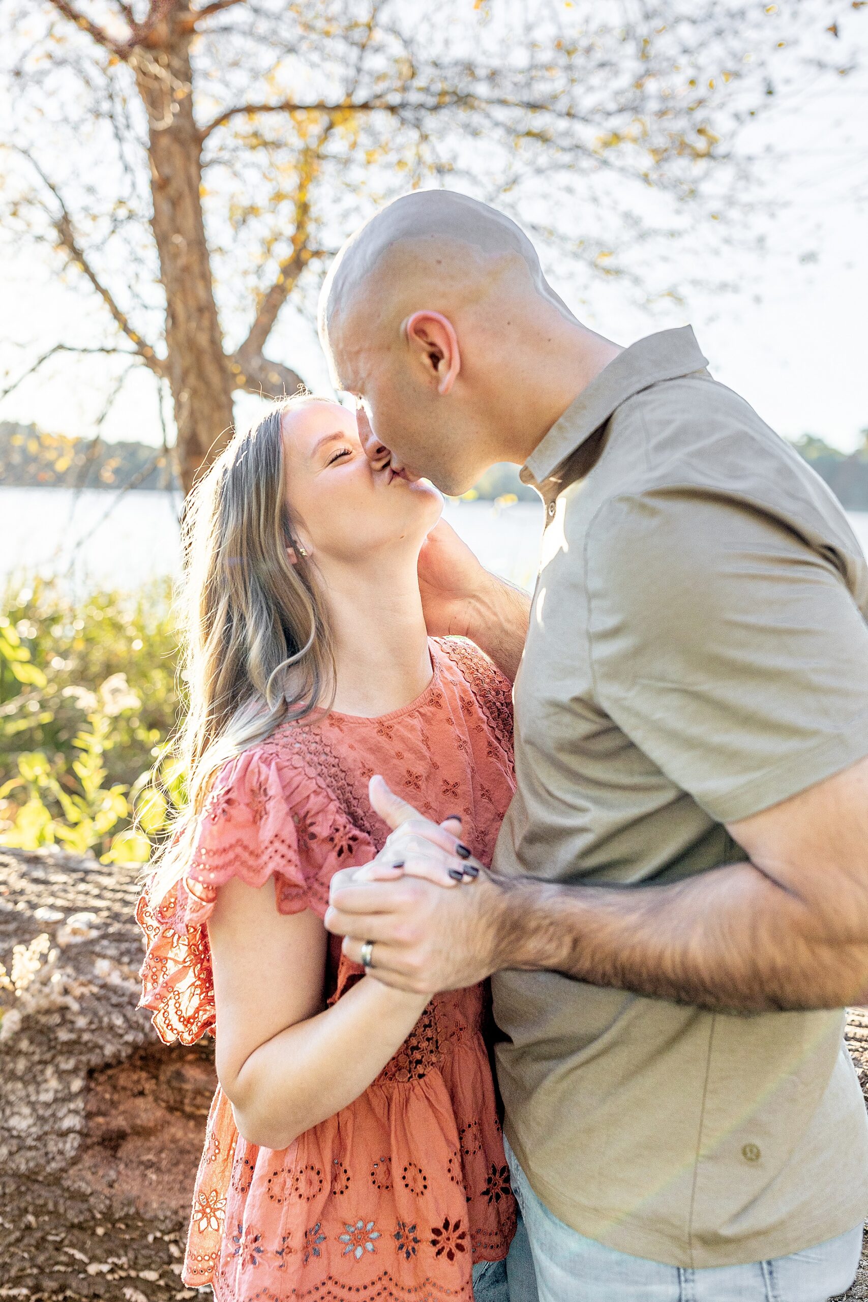 couple kiss during family session