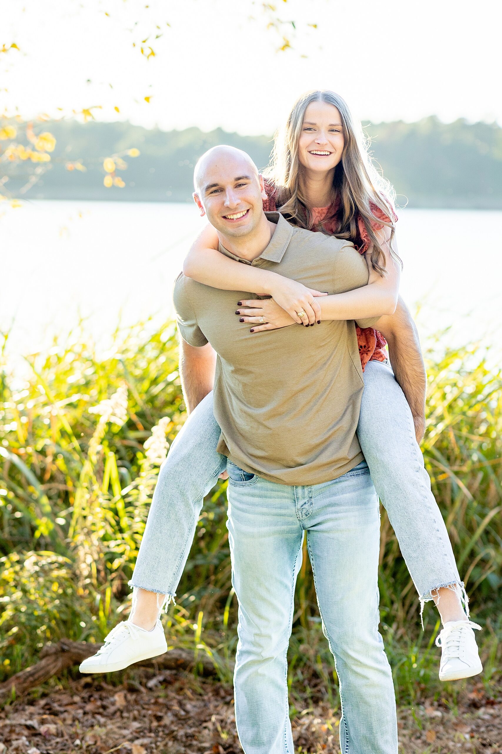 guy carries his wife at Tyler State Park in Texas