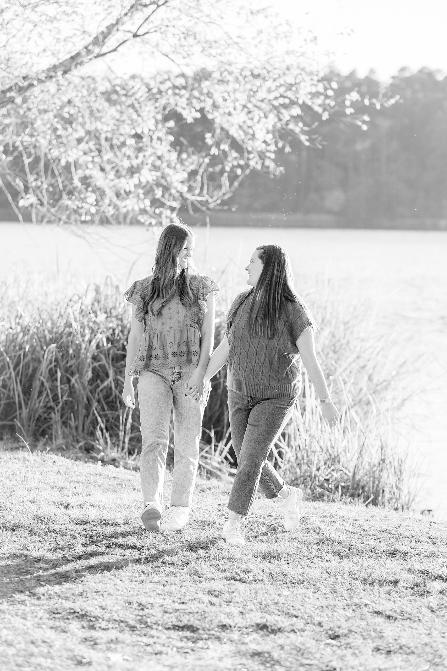 sisters hold hands and walk together