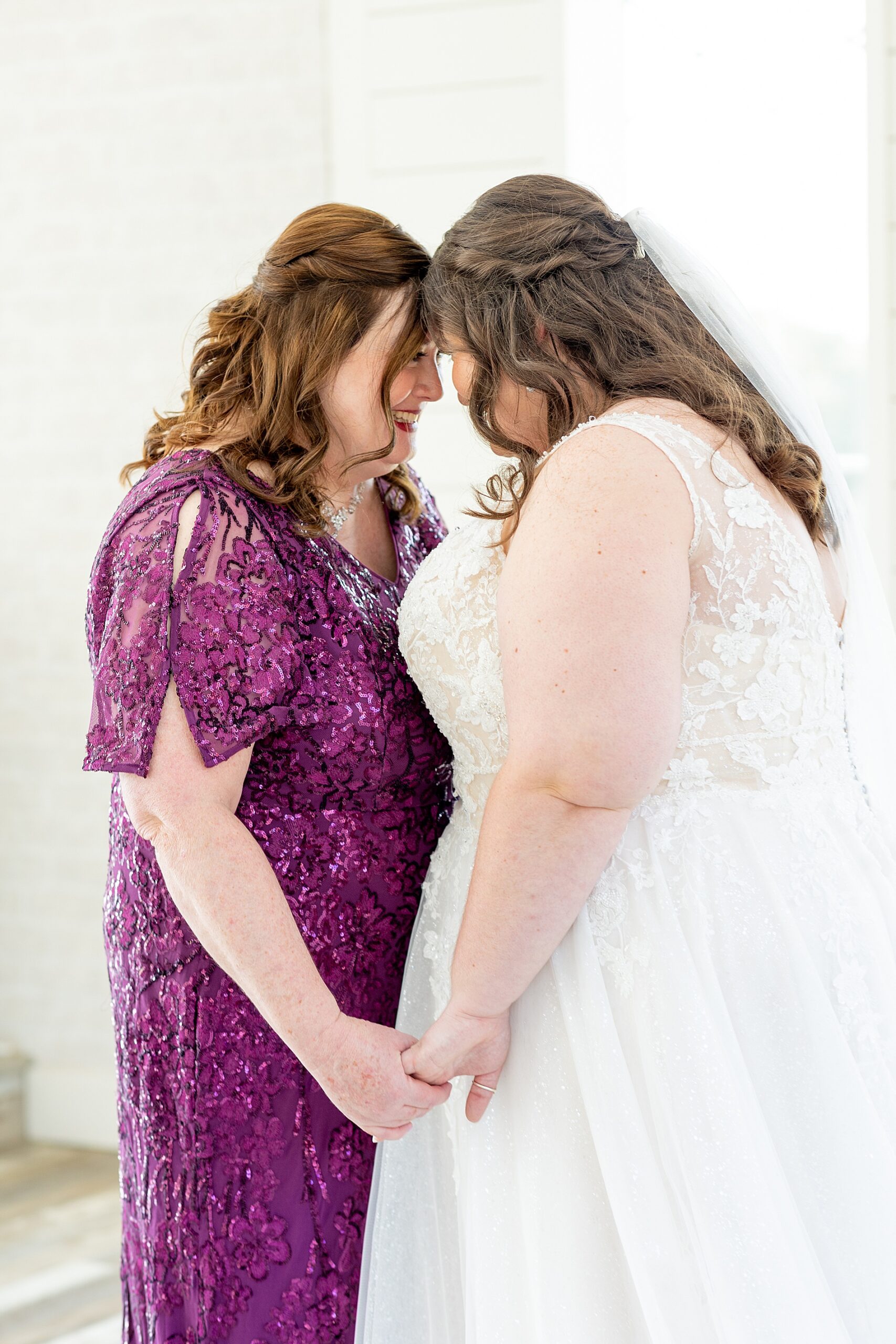 bride with her mom on the morning of wedding 