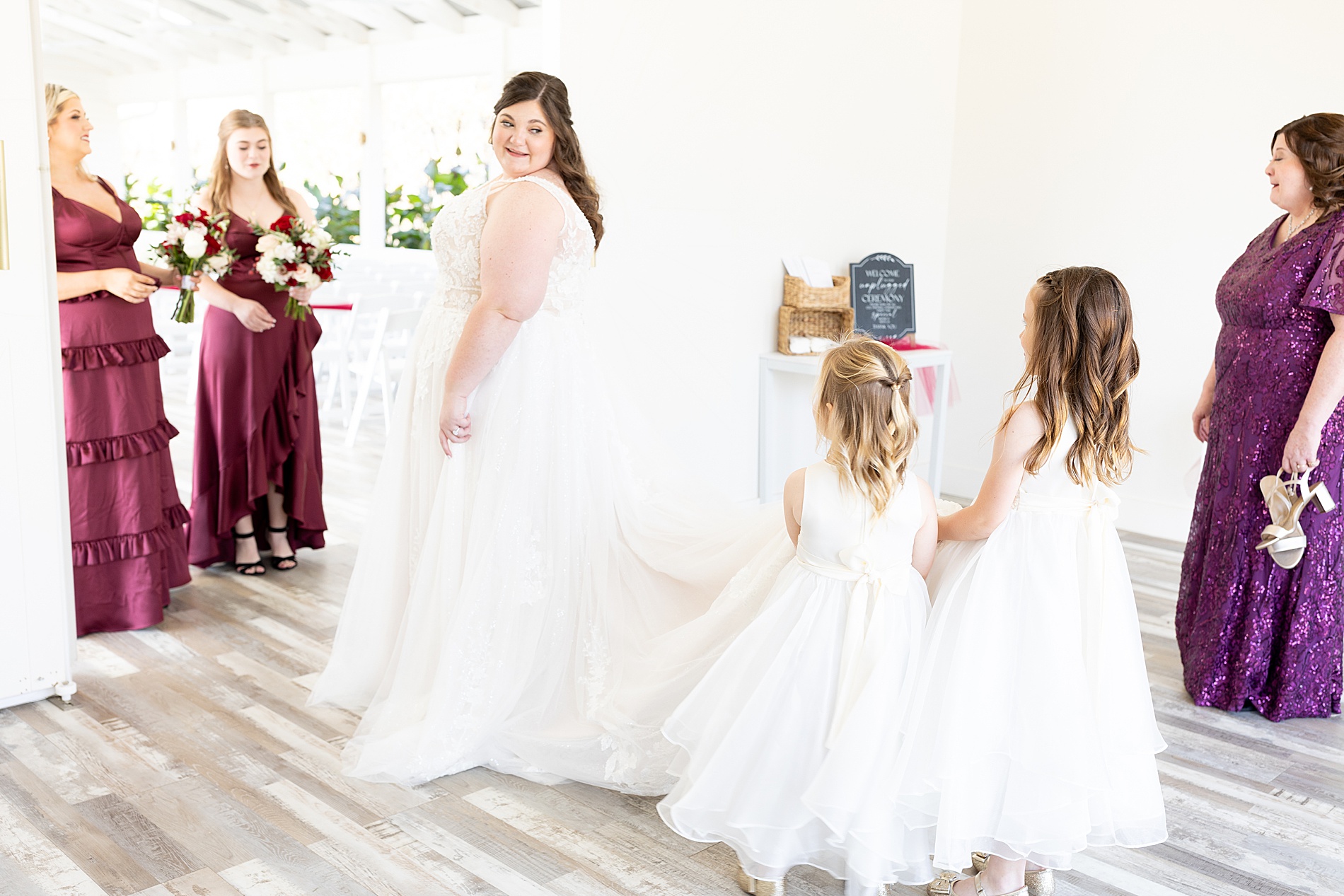 flower girls admire bride