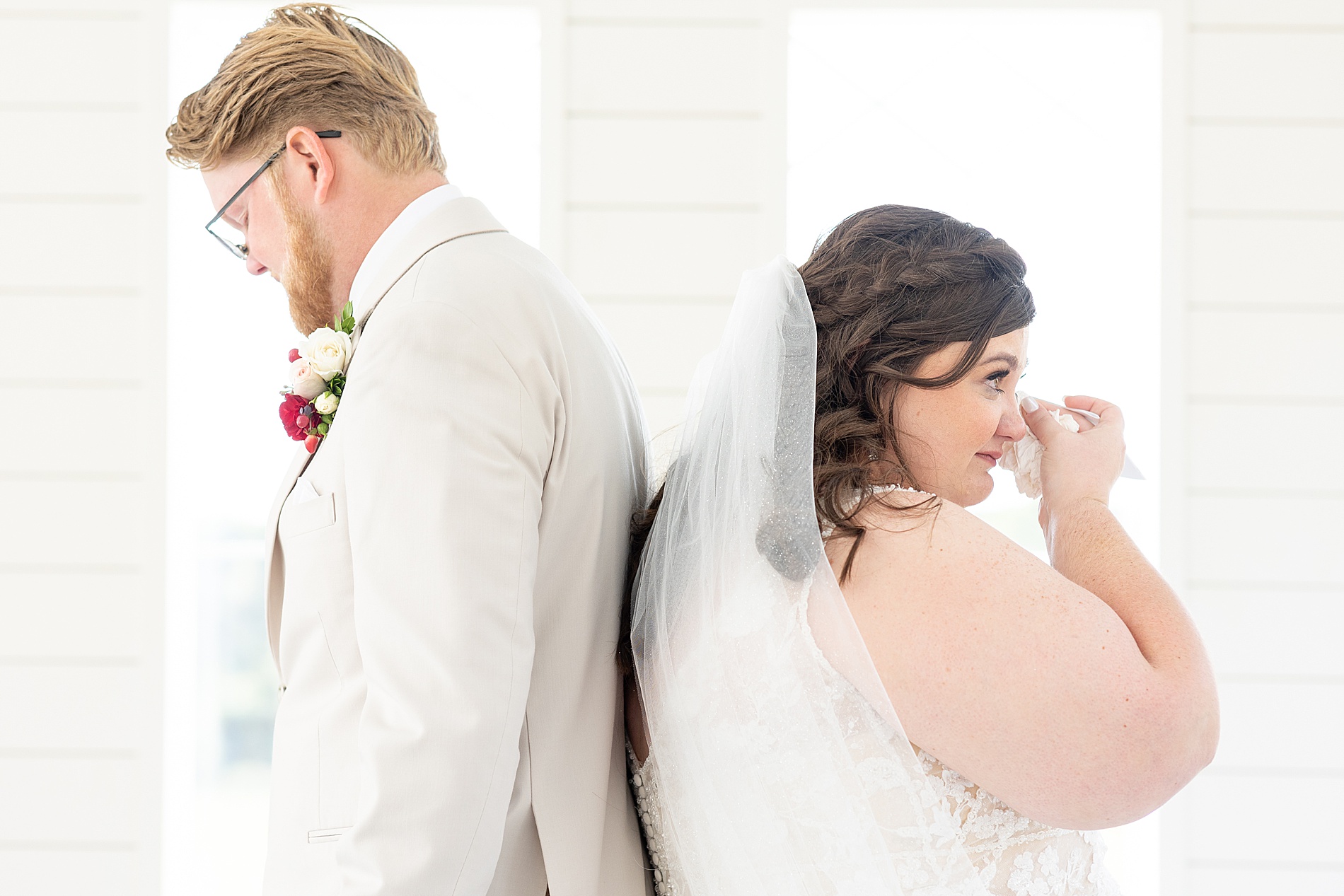 bride wipes away tears during private vow exchange