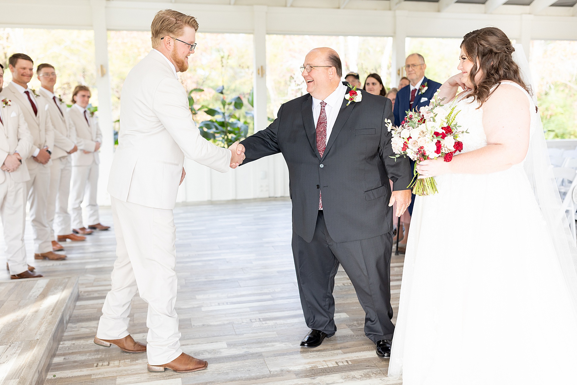 father giving daughter away at wedding