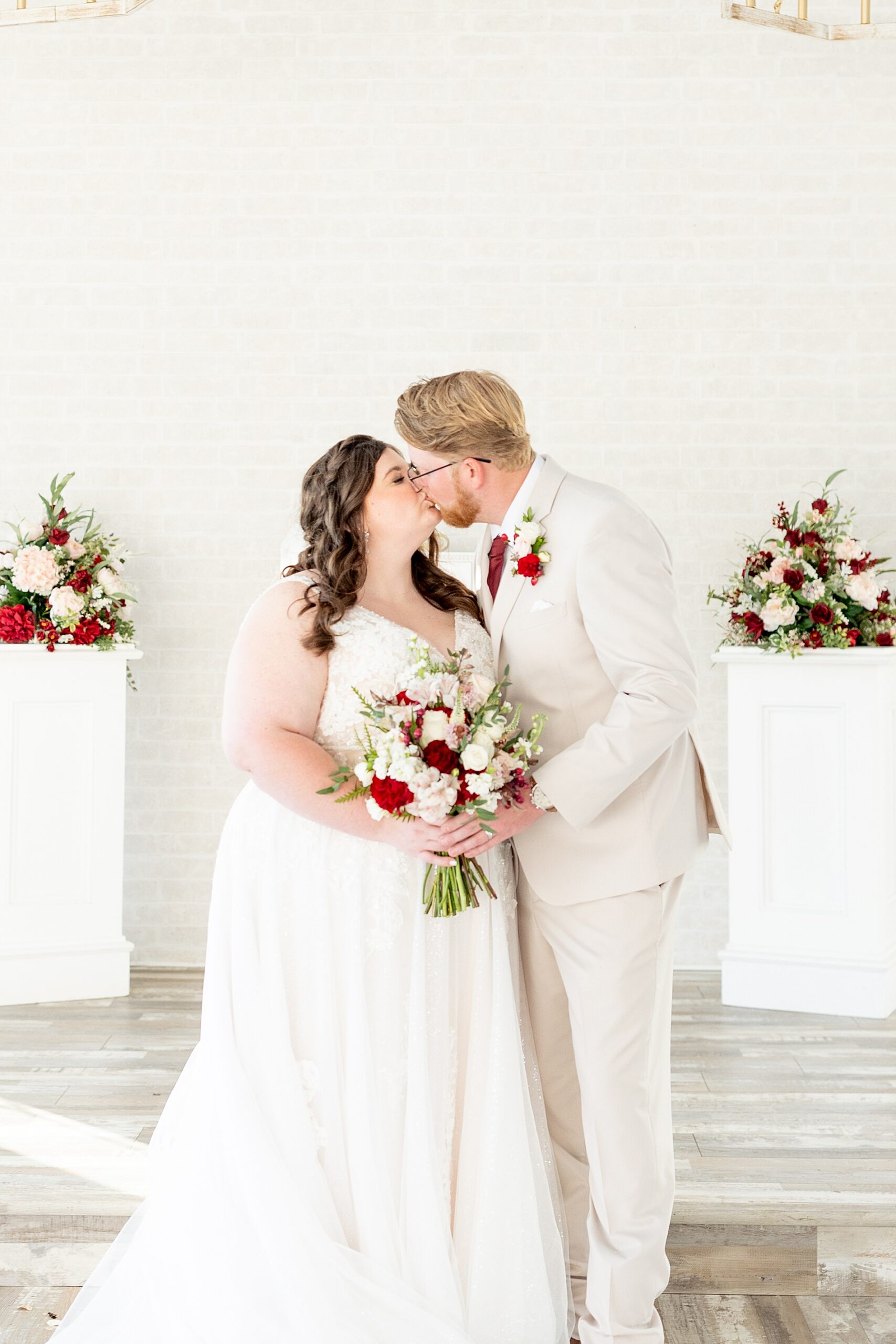 couple kiss after wedding ceremony 