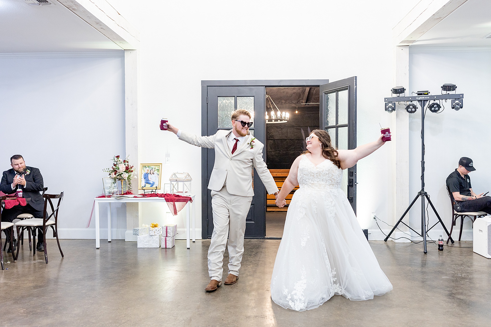 newlyweds celebrate as they enter reception 