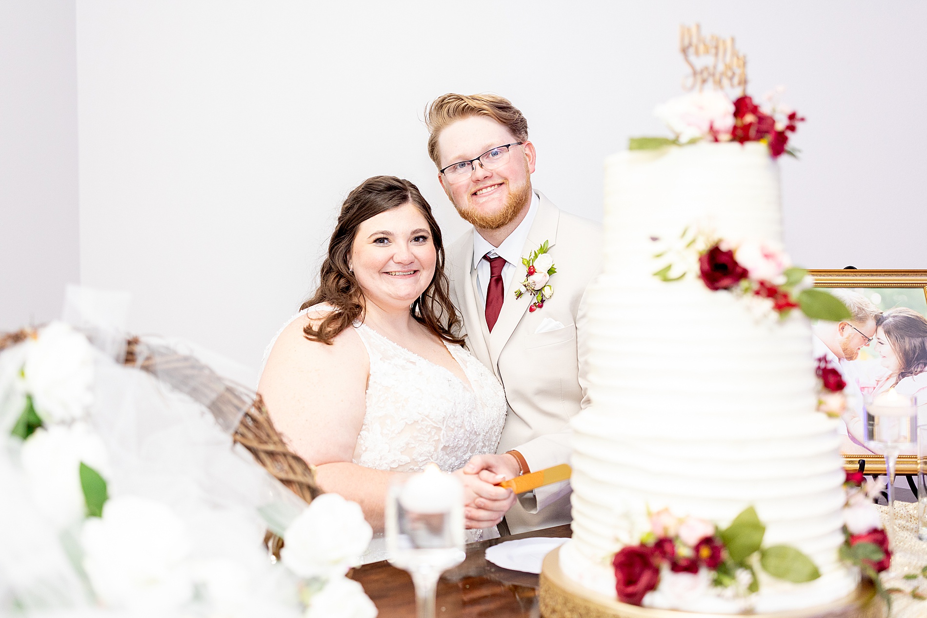 couple by wedding cake 