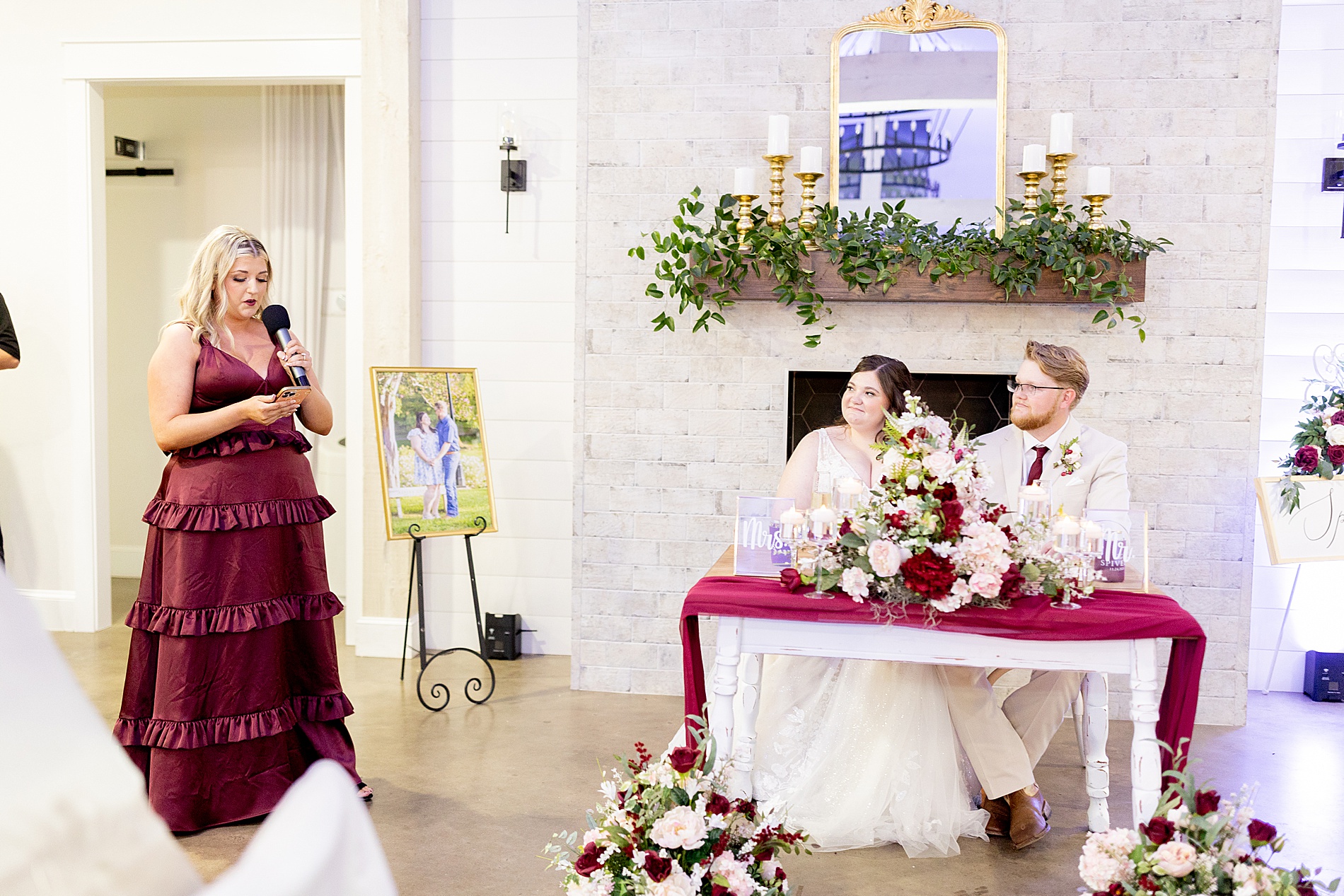 newlyweds listen to wedding speeches