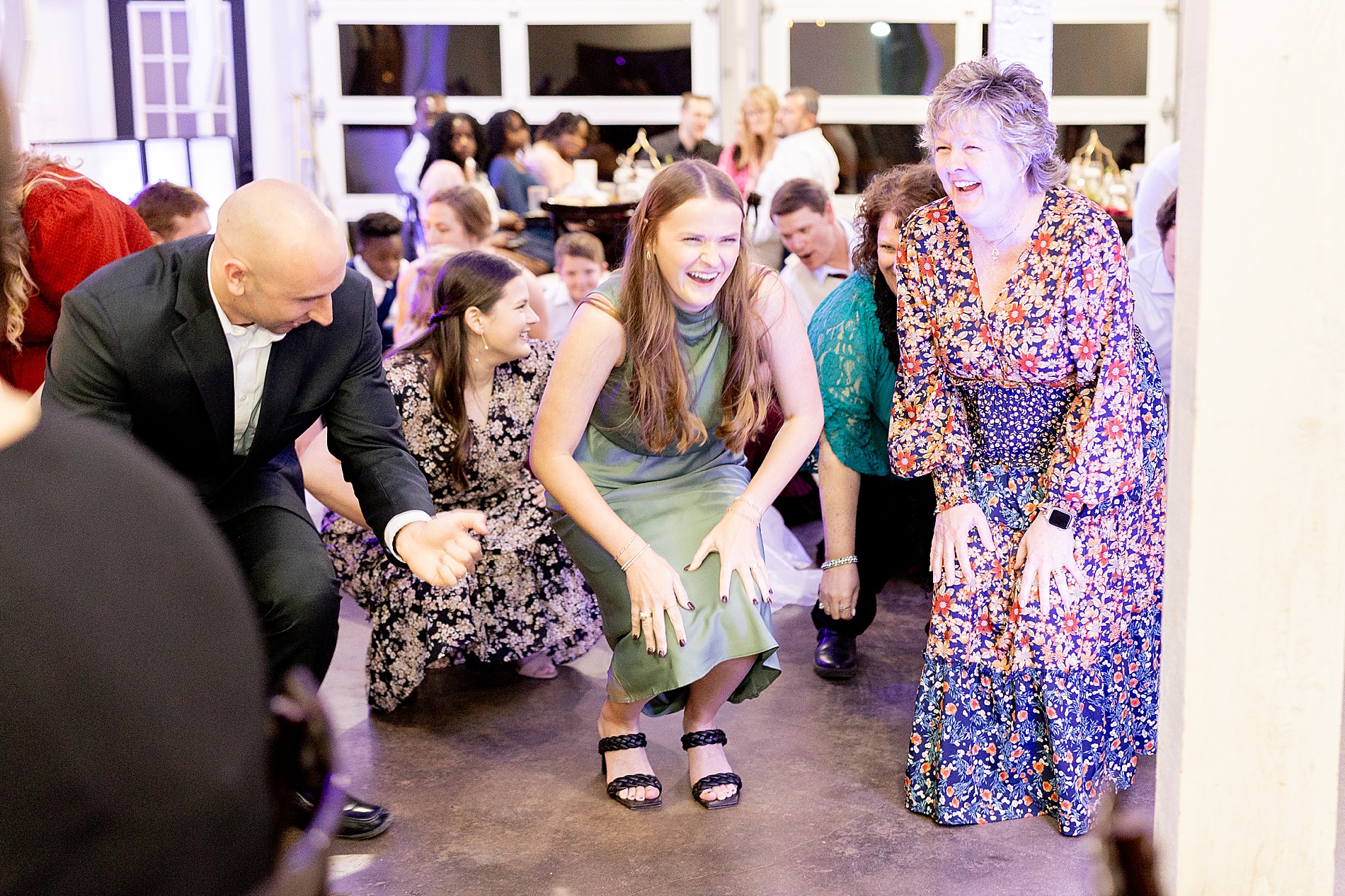 wedding guests dance at reception