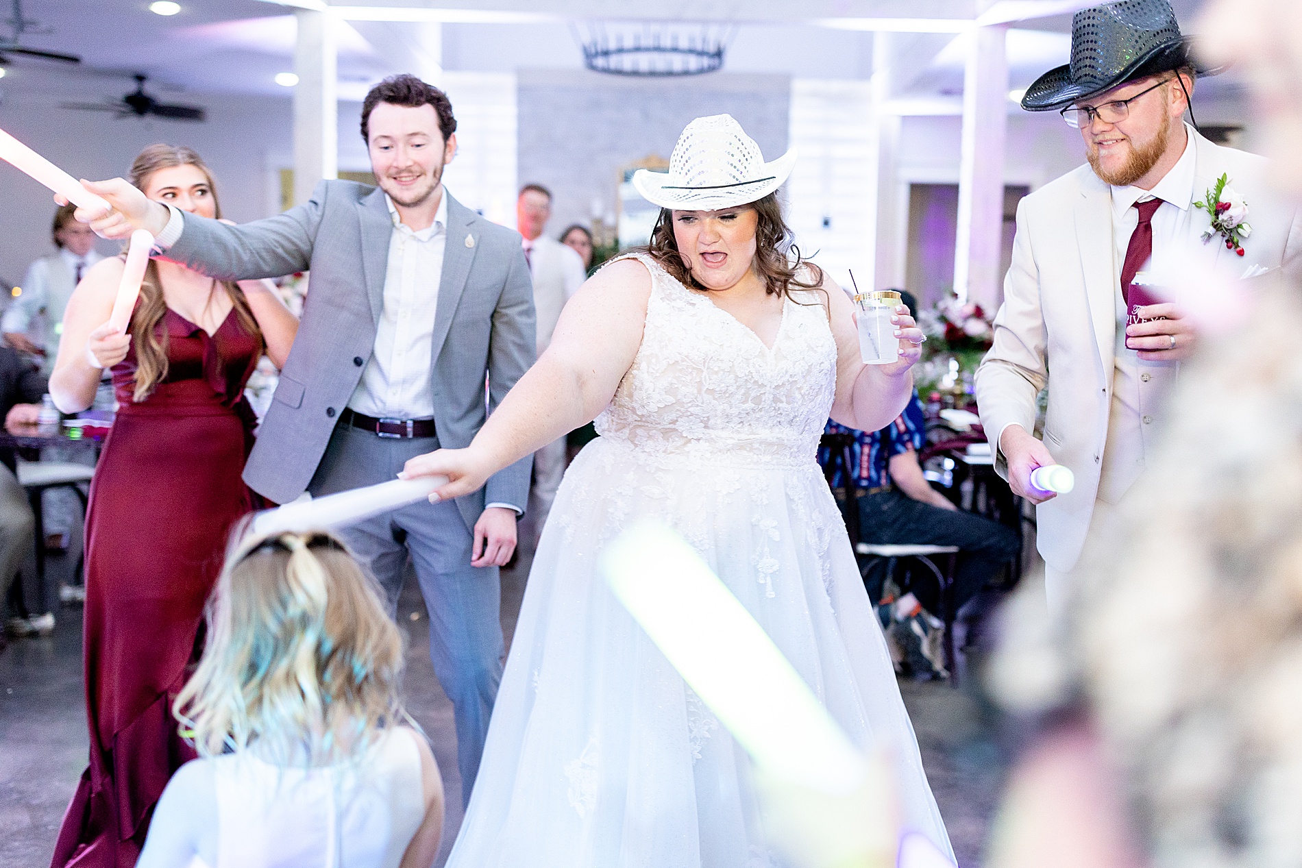 bride and groom in cowboy hats