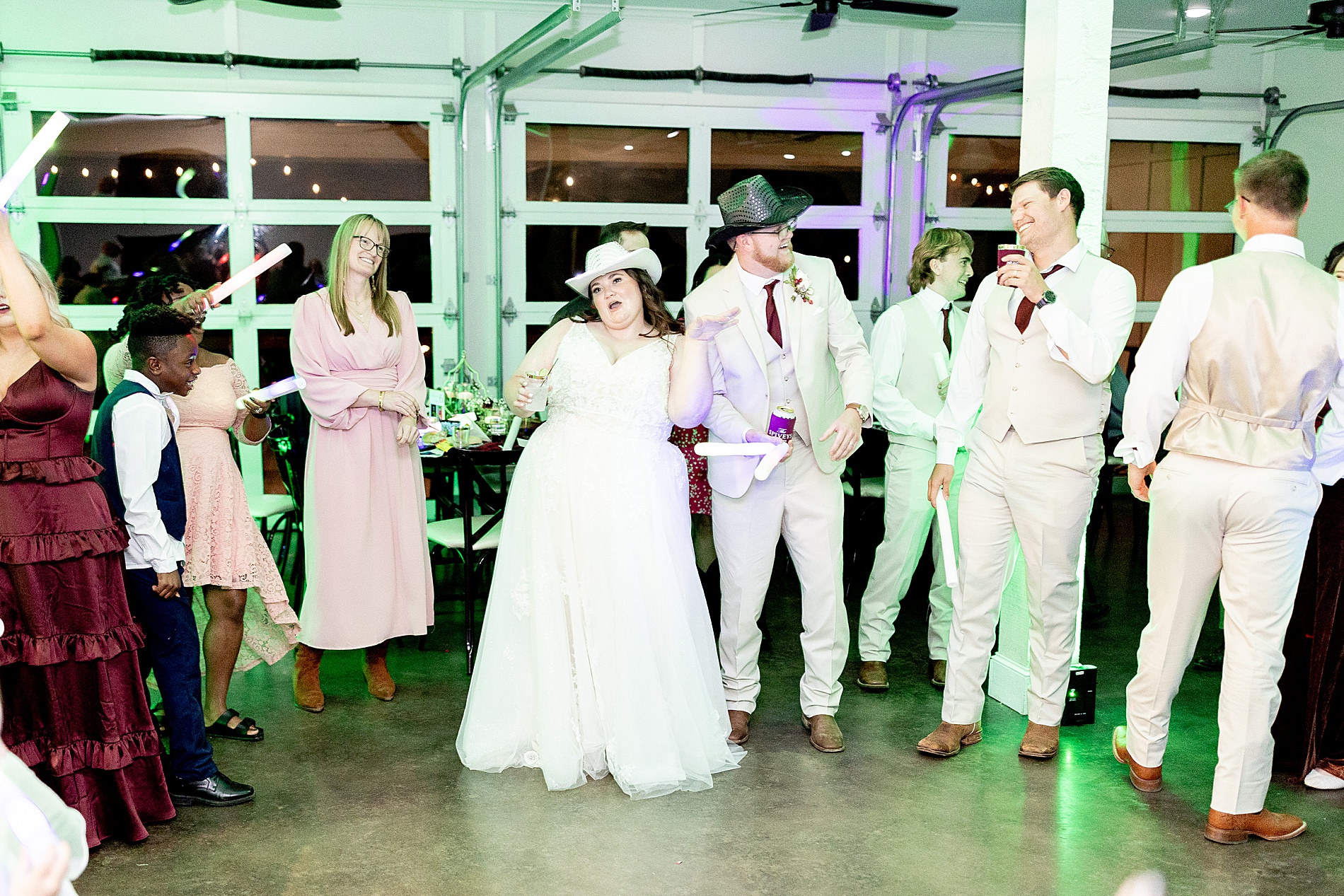 bride and groom dance with guests