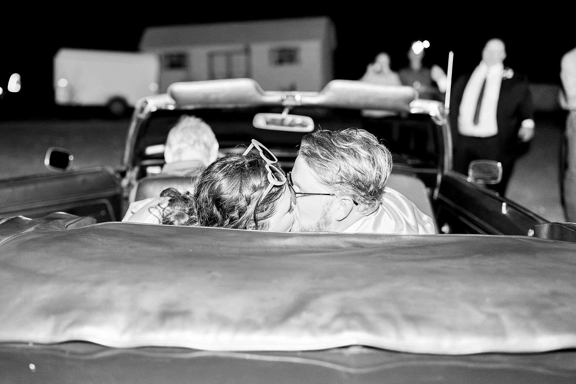 newlyweds in backseat of vintage car