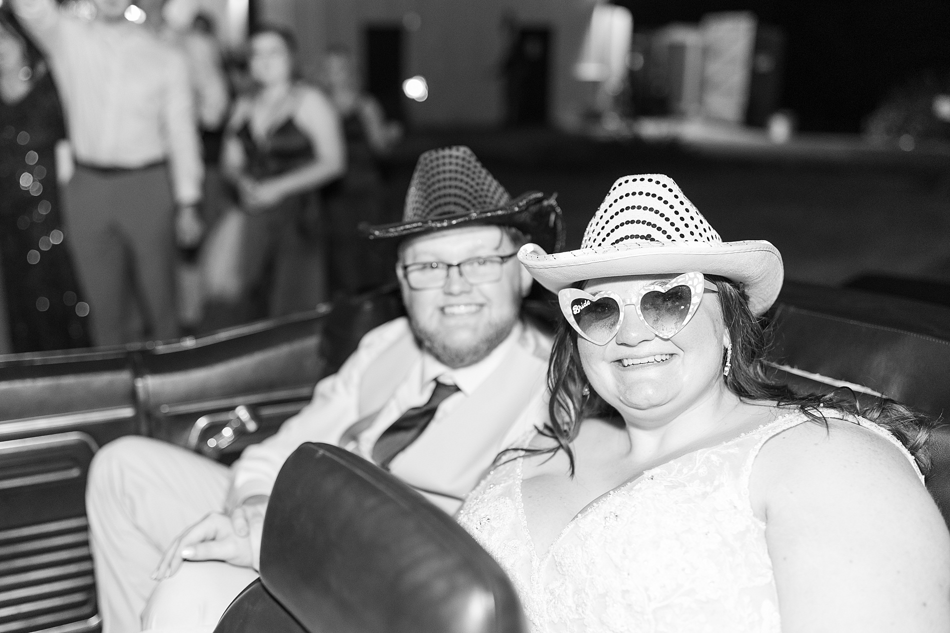 newlyweds in back of car