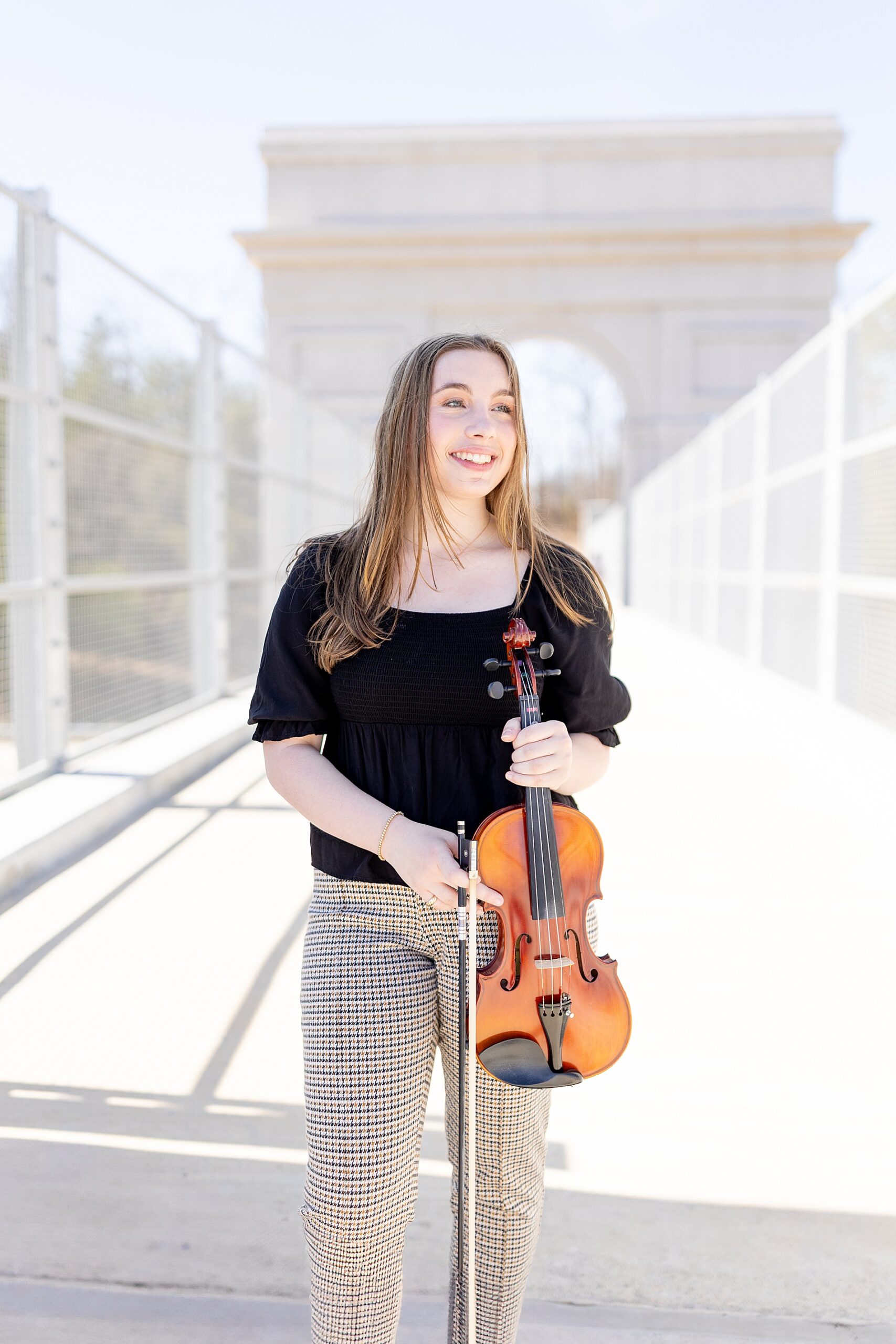 senior with violin at at BridgeWay Station in Mauldin, South Carolina
