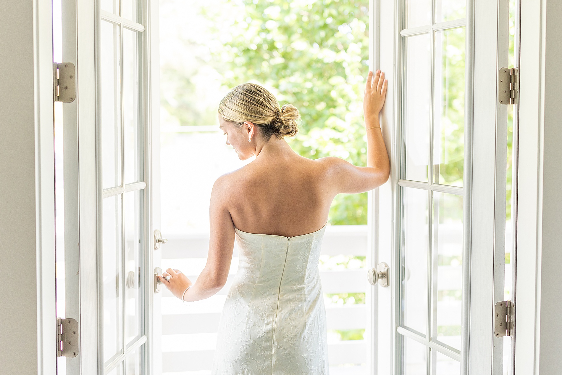 bride walks out of double doors