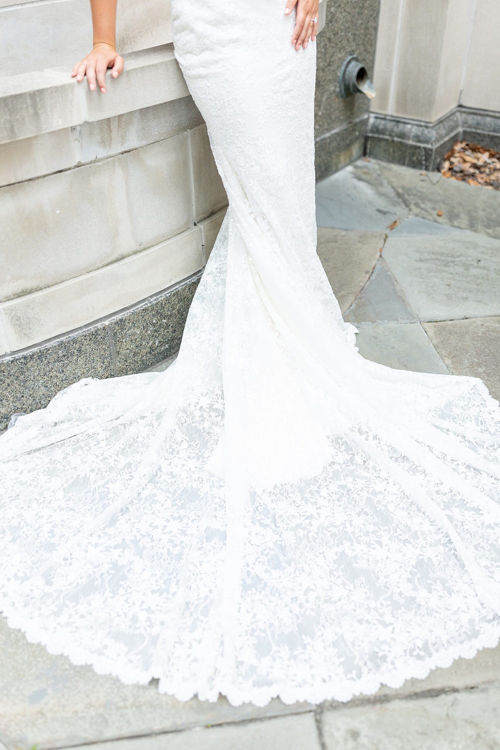 bottom of bride's wedding dress with lace embellishments