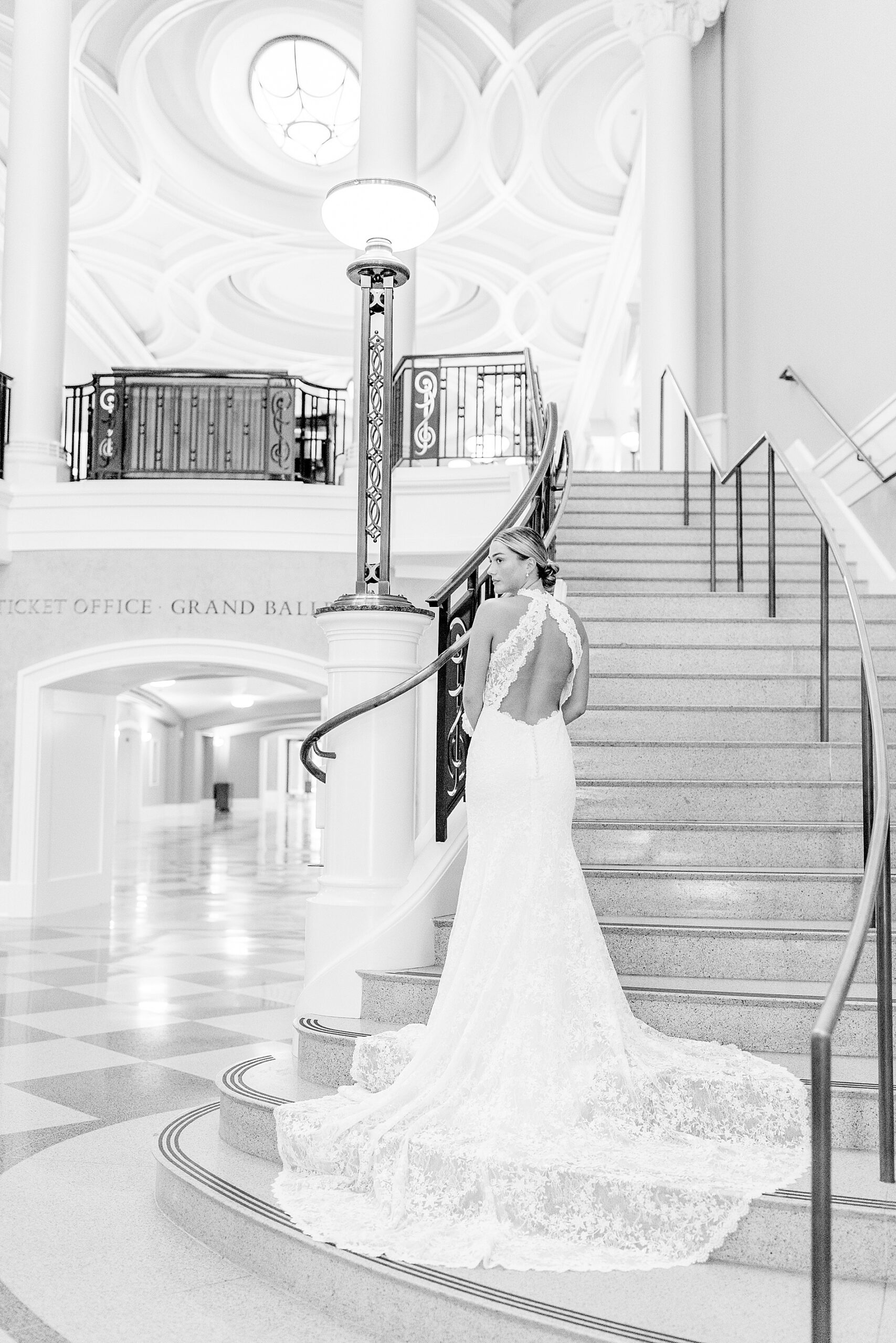 Bride on bottom of winding staircase