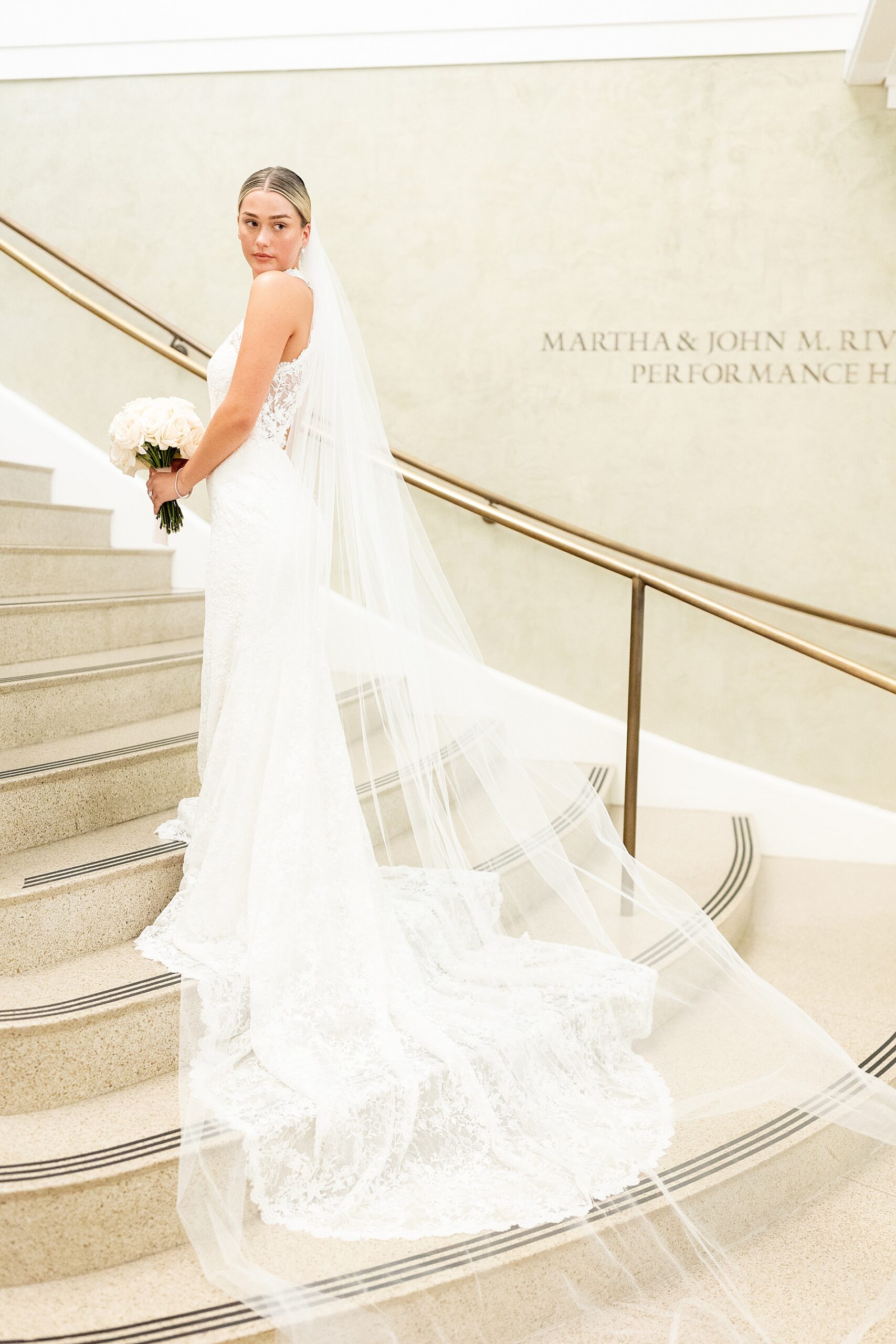 bride on staircase in downtown Charleston from styled shoot