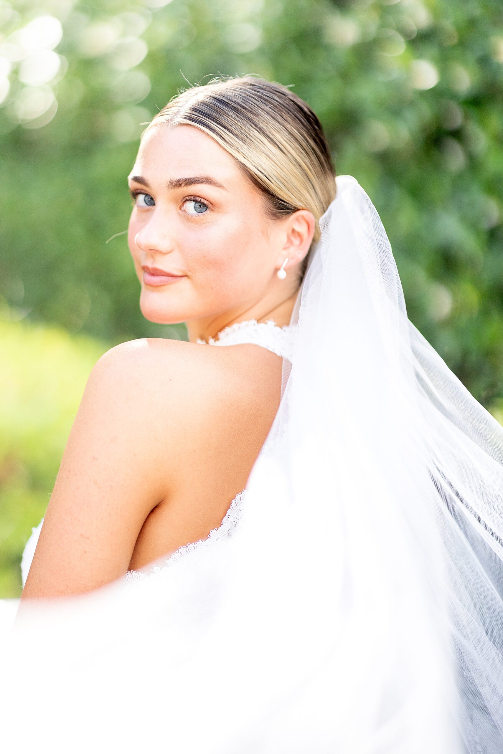 bride with veil flowing behind