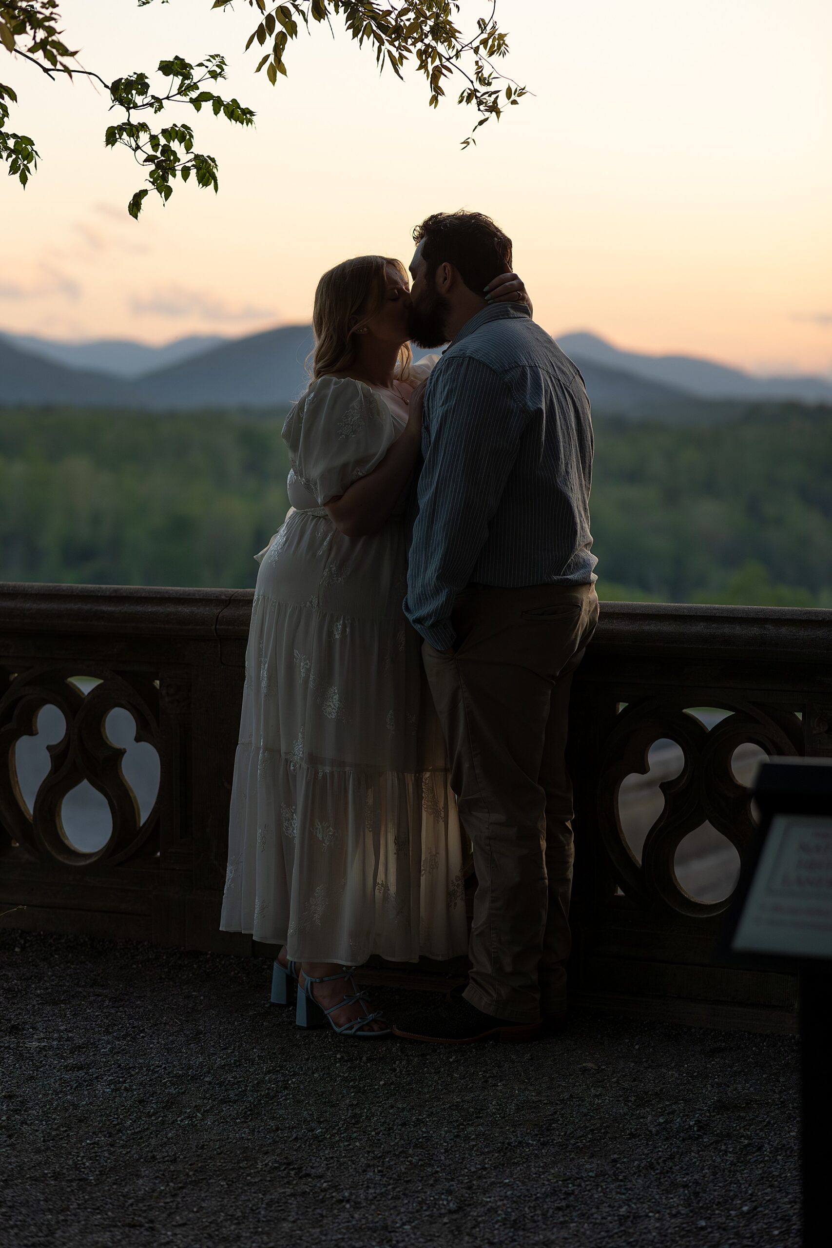 couple kiss as the sun goes down