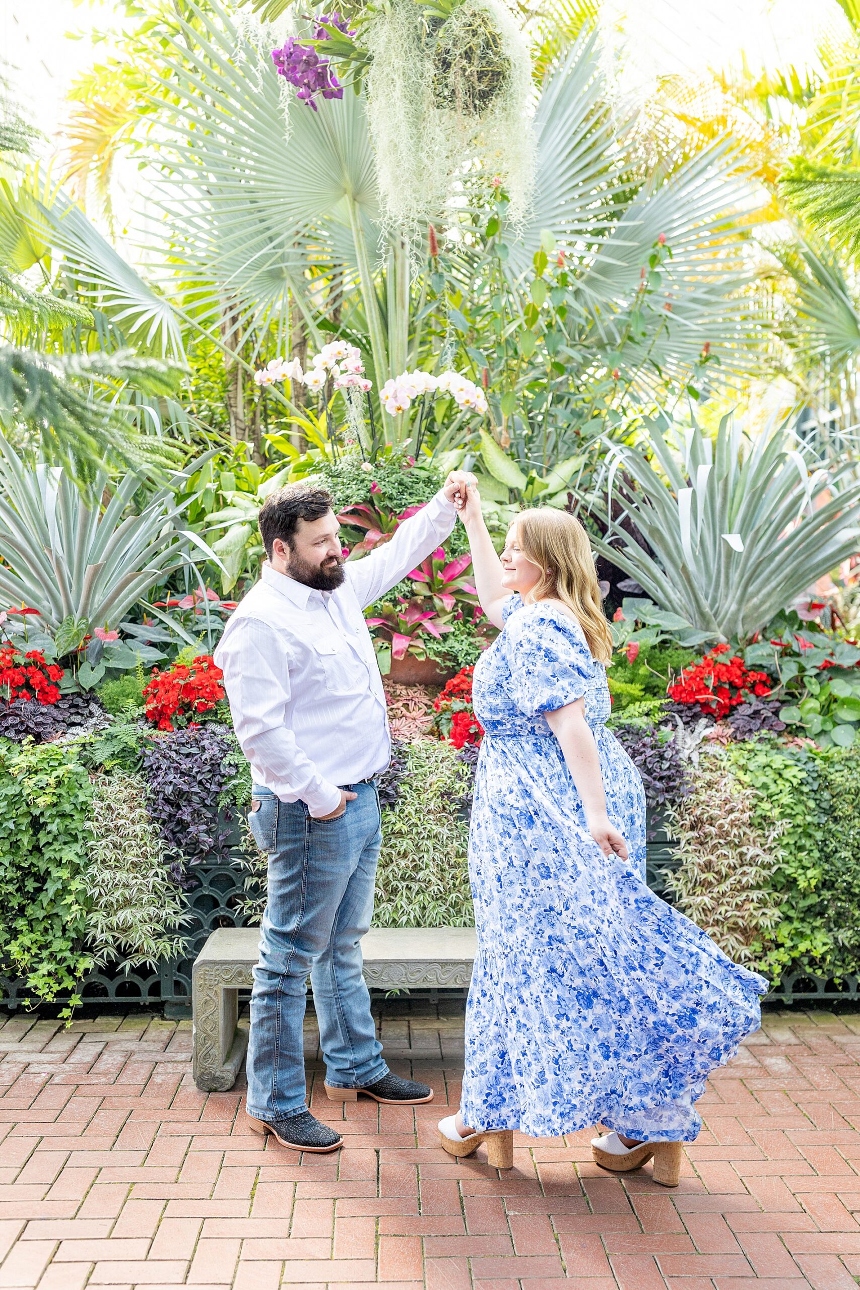 couple dance around garden in Asheville, NC