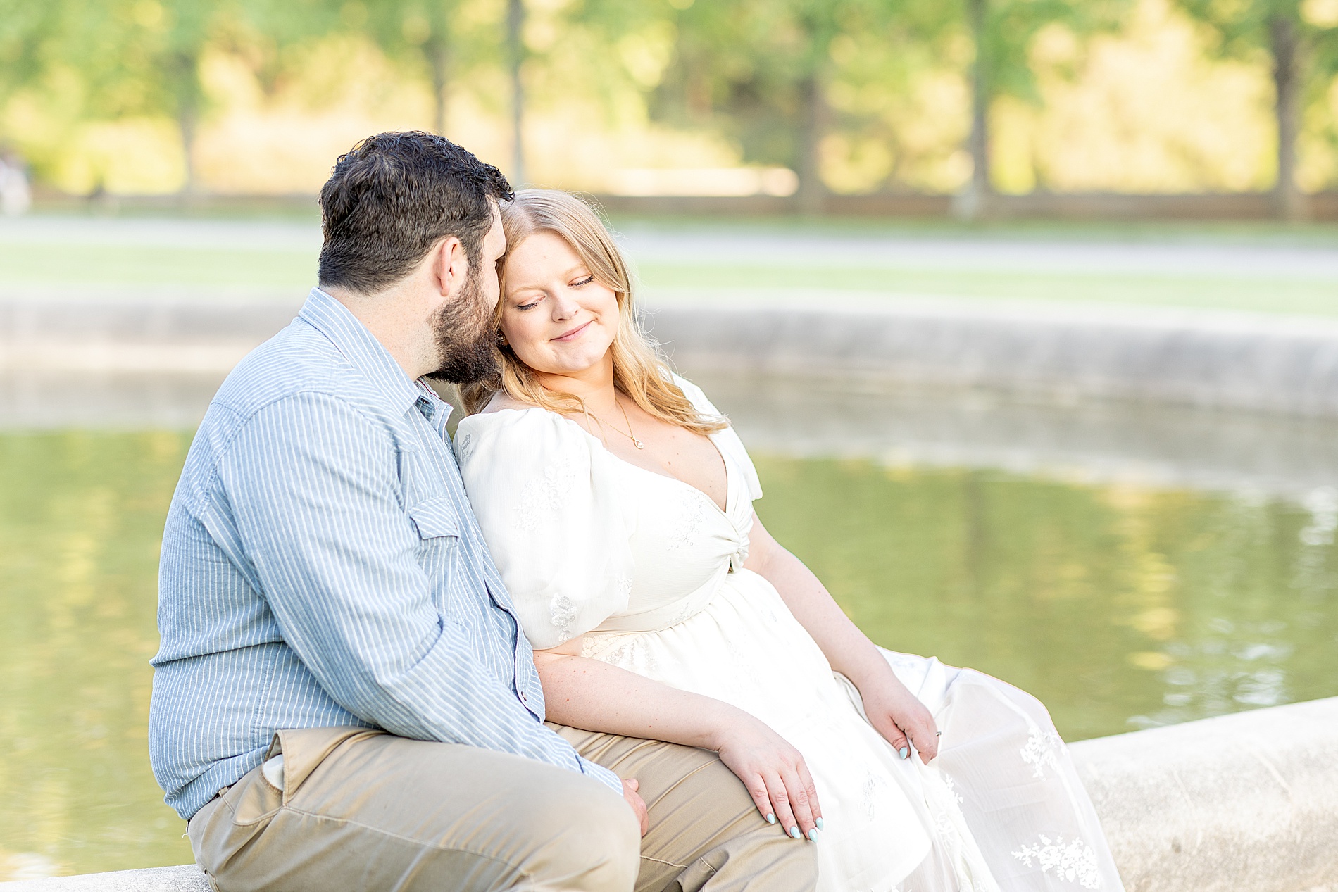 couple sit by fountain at Biltmore Estate