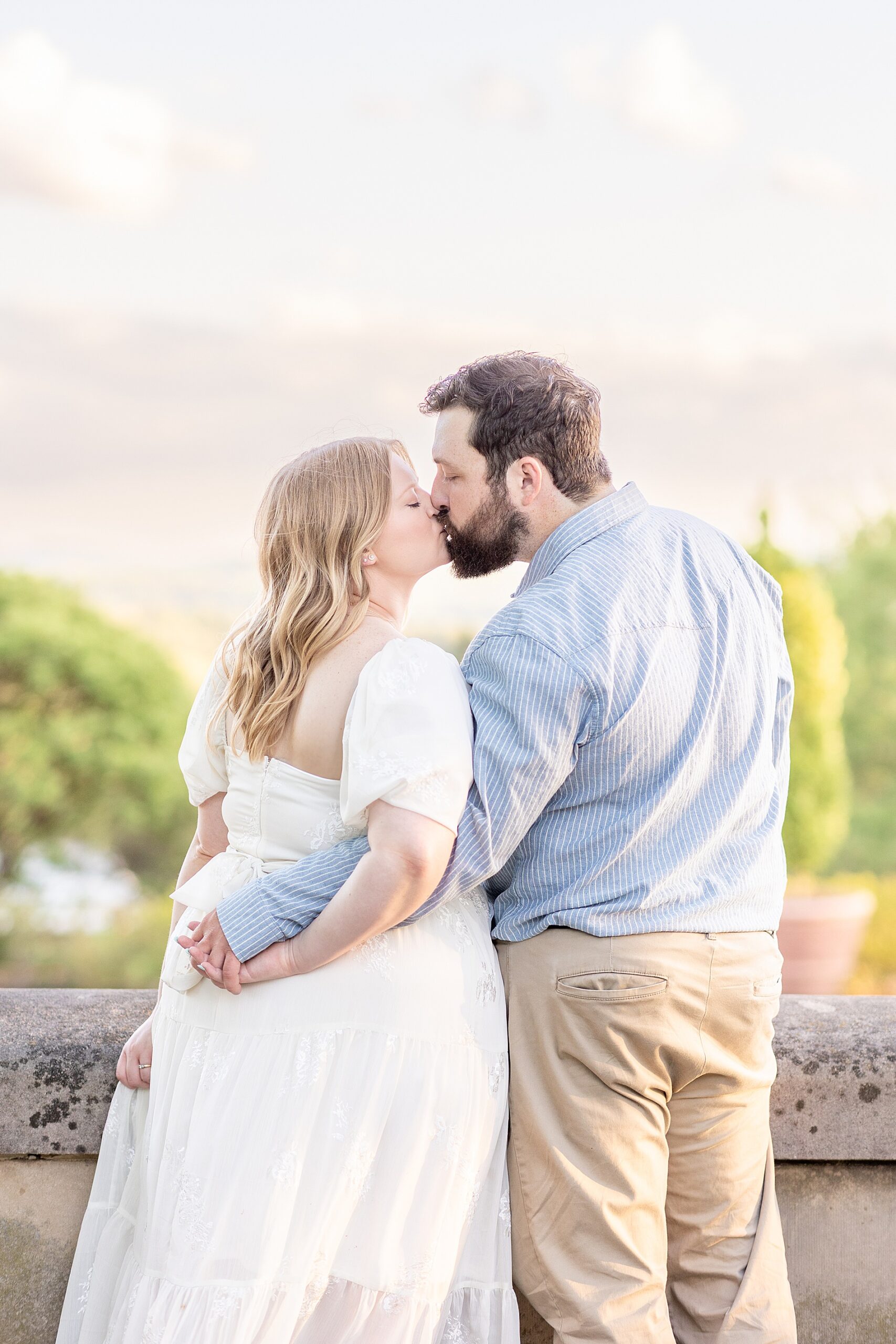 engaged couple kiss during spring session